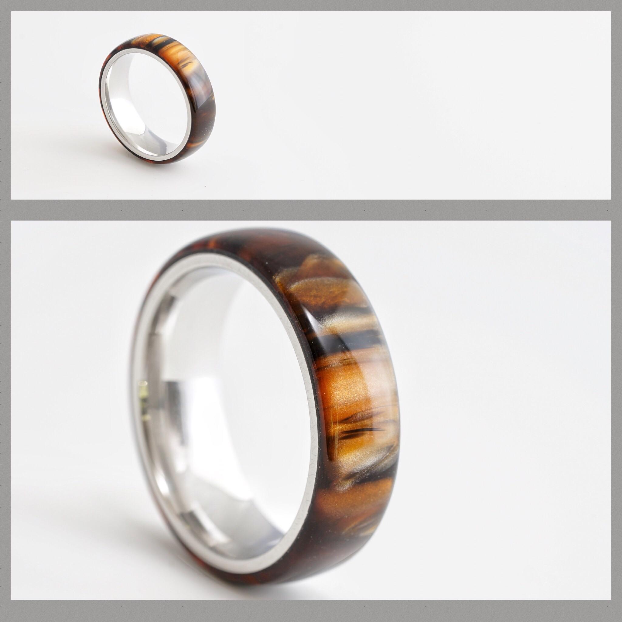 Turned an acrylic and stainless ring r/turning