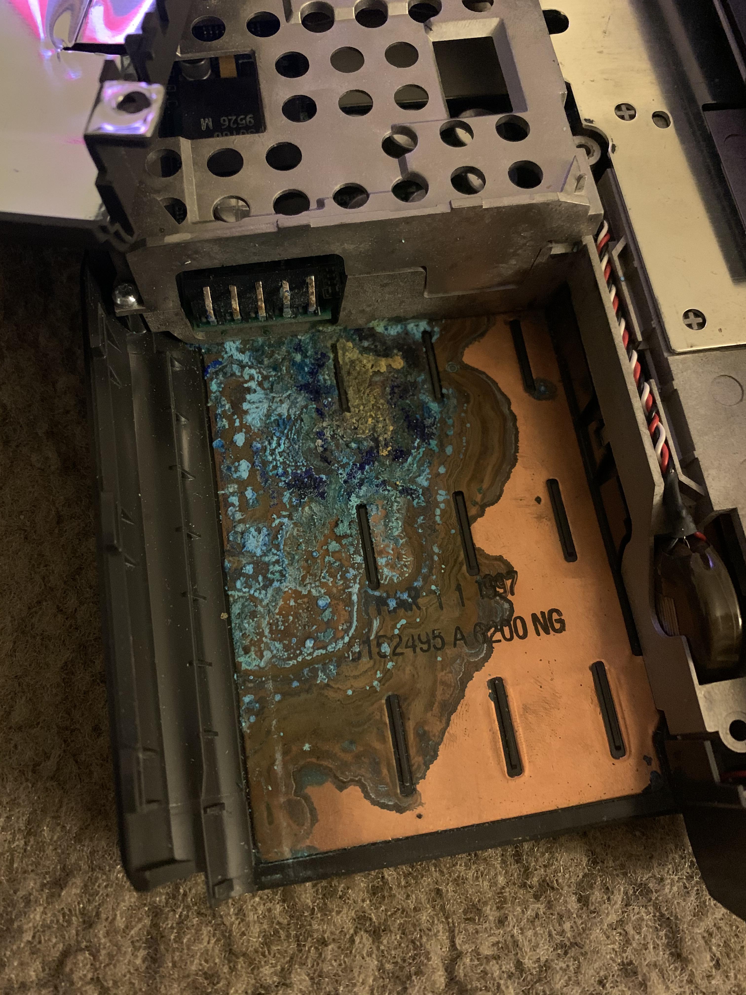 How do I clean this mess from an exploded battery? This is my PowerBook 190cs and the battery