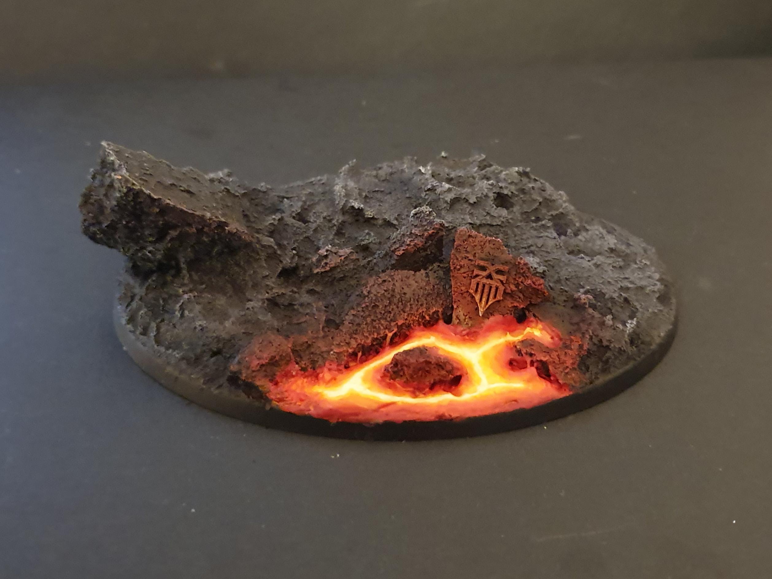 My best work so far in painting realistic lava. This is a base for a Warhammer miniature. r