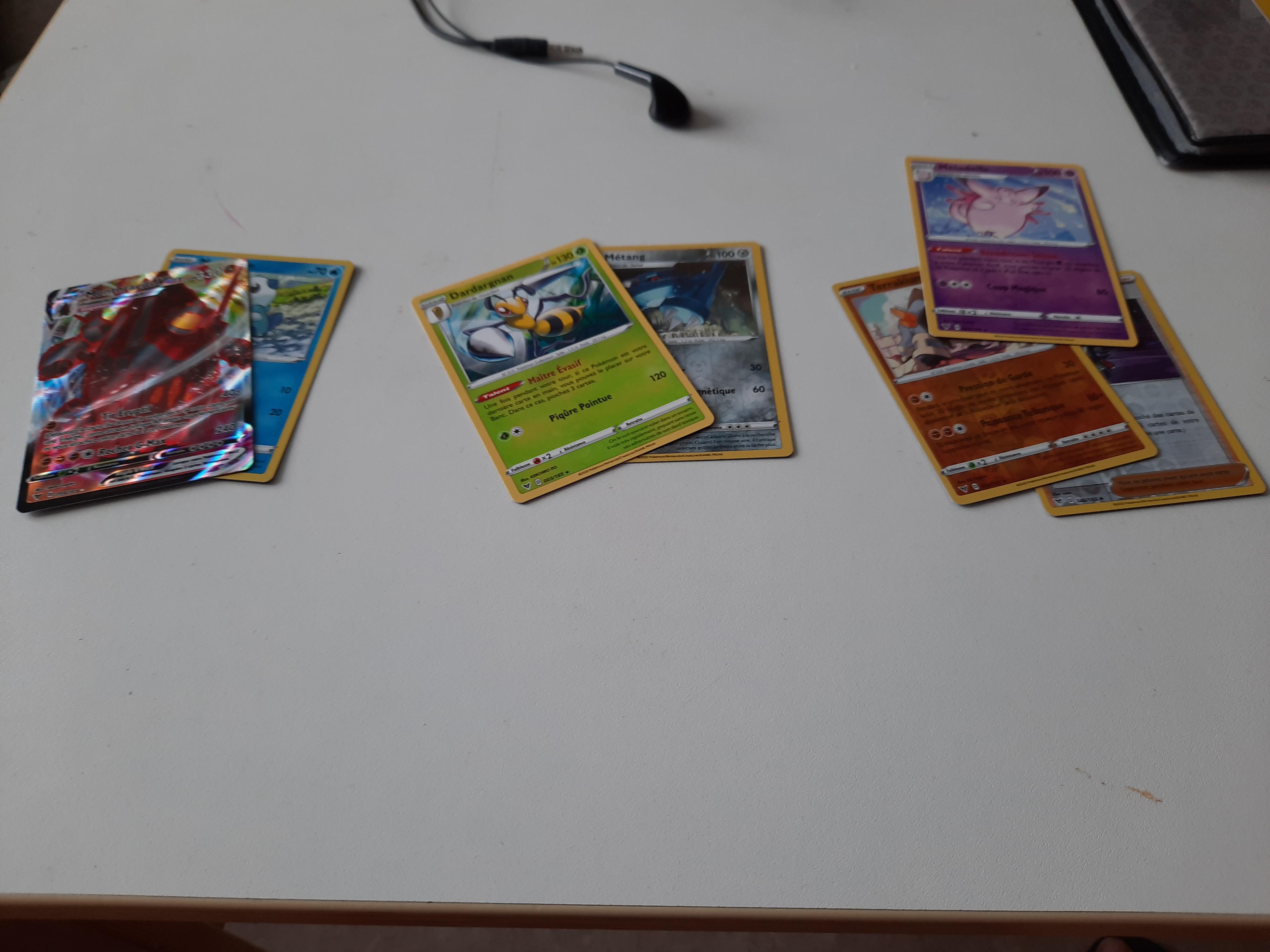 My mom predicted ( from left to right ), rare, nothing and super rare. Got a VMAX Coalossal, a