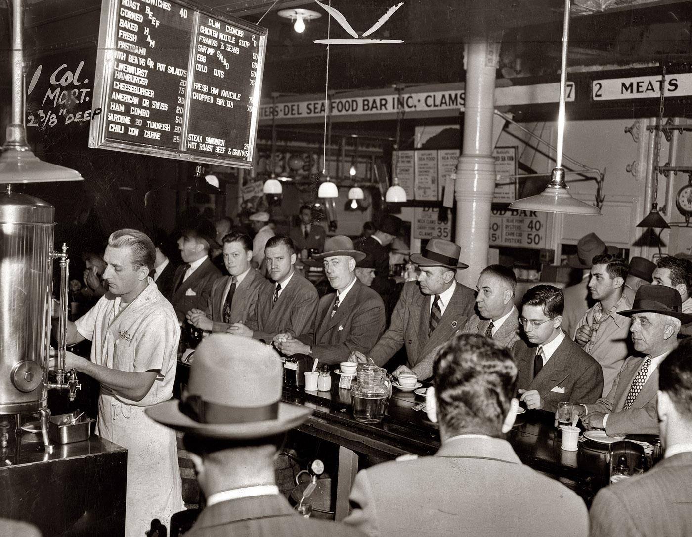 "Cheeseburger 30 cents" 1950 Lunchtime at Pete's Bar in Lower Manhattan. Photo by Al Aumuller