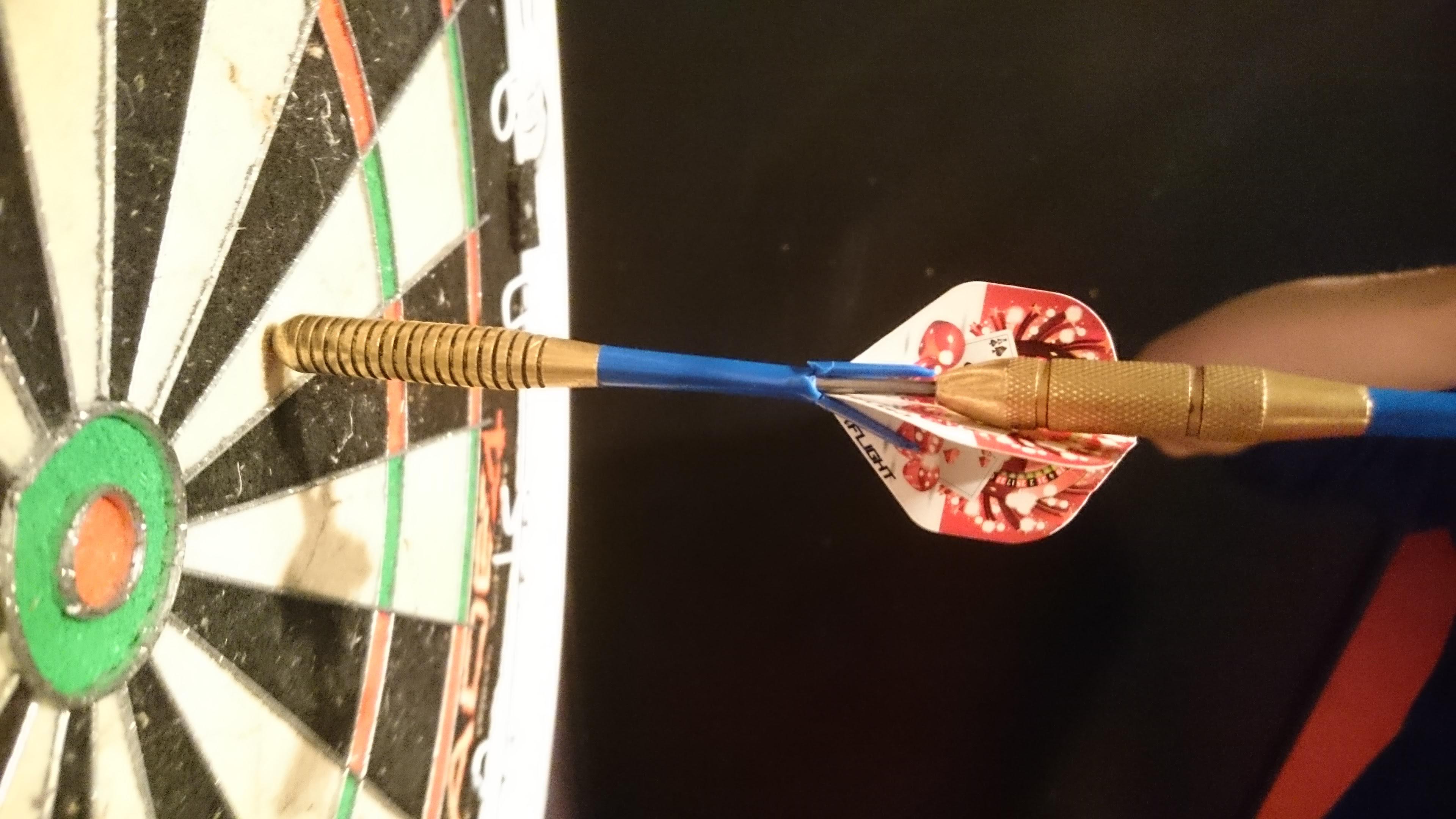 My first game of darts, I shot my dart, into a dart r/mildlyinteresting