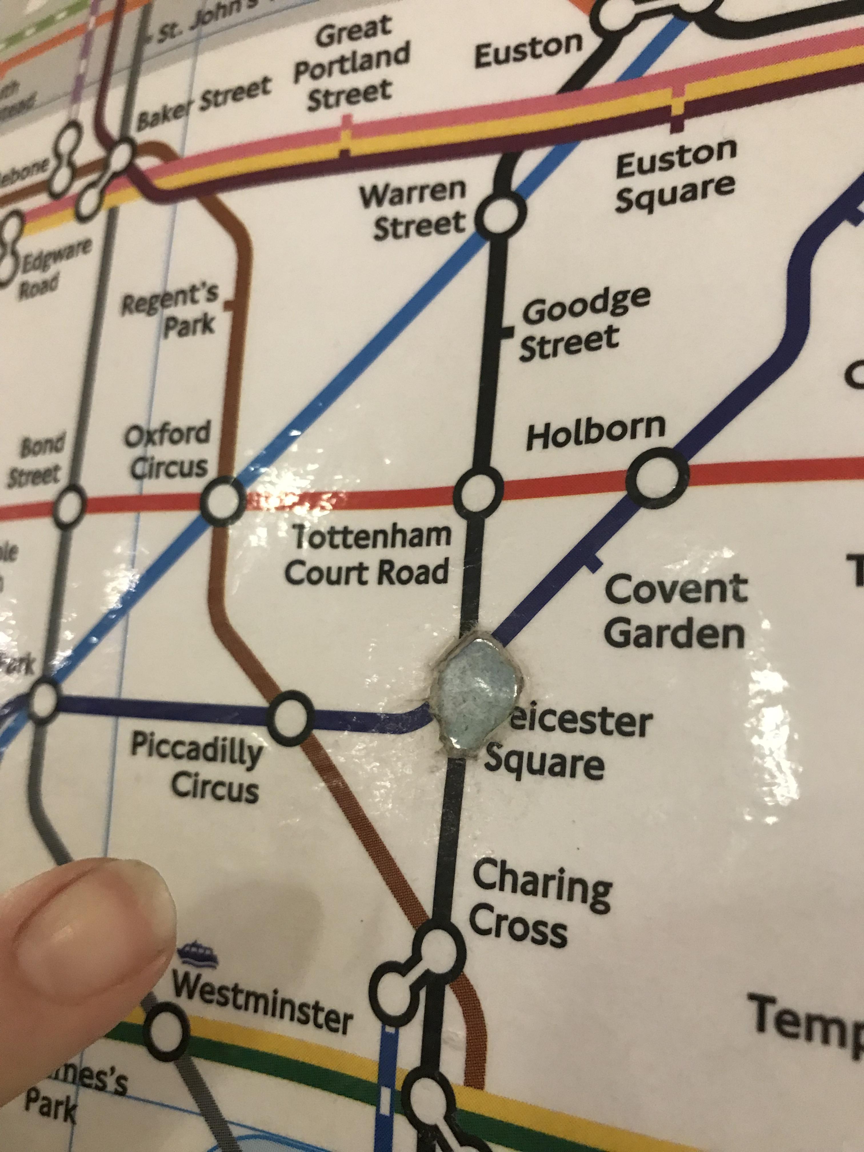 At Leicester Square Tube Station, London, UK. So many people have put their finger on the map