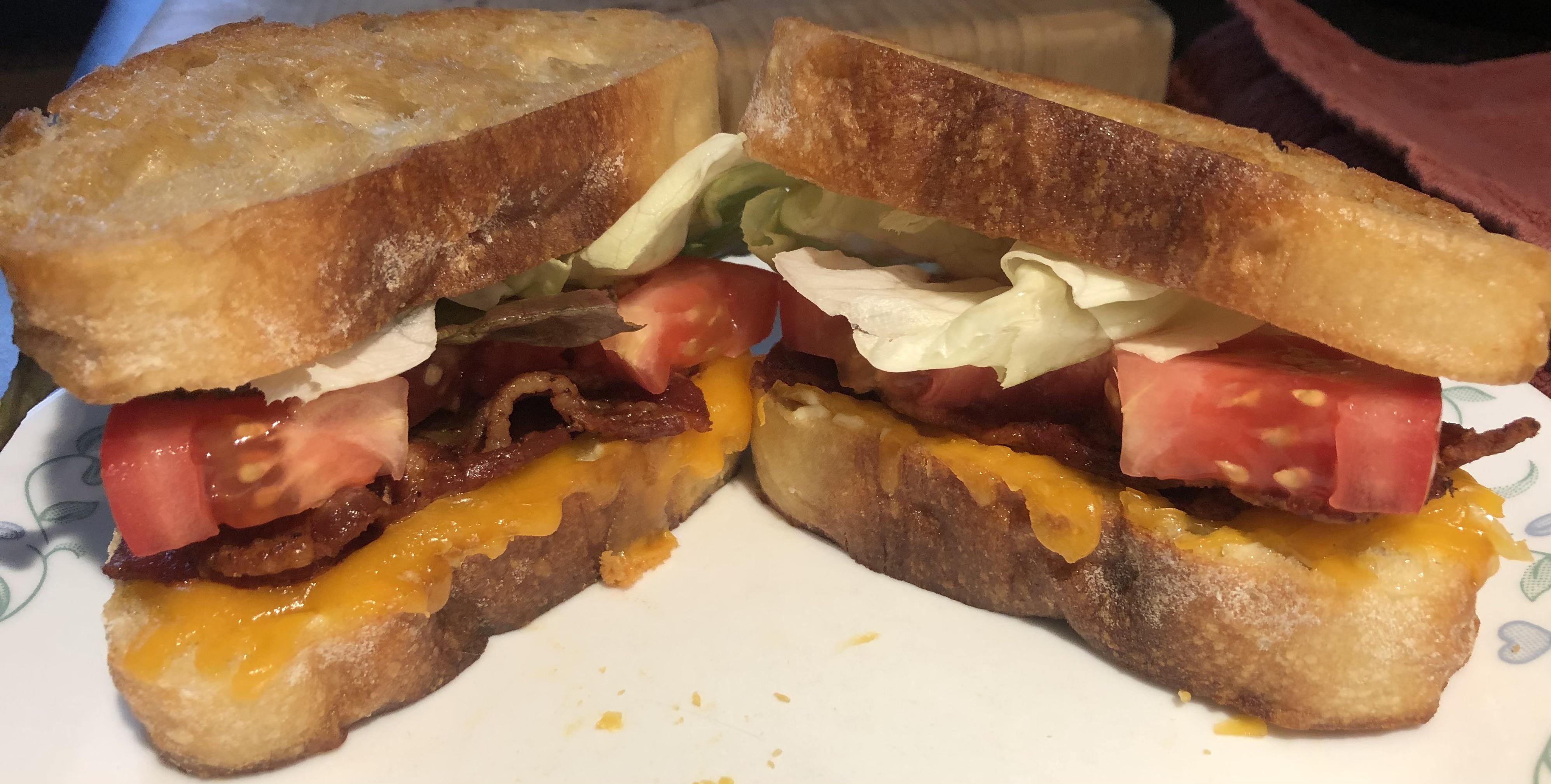 Grilled cheese BLTs with farmers’ market tomatoes and lettuce. My