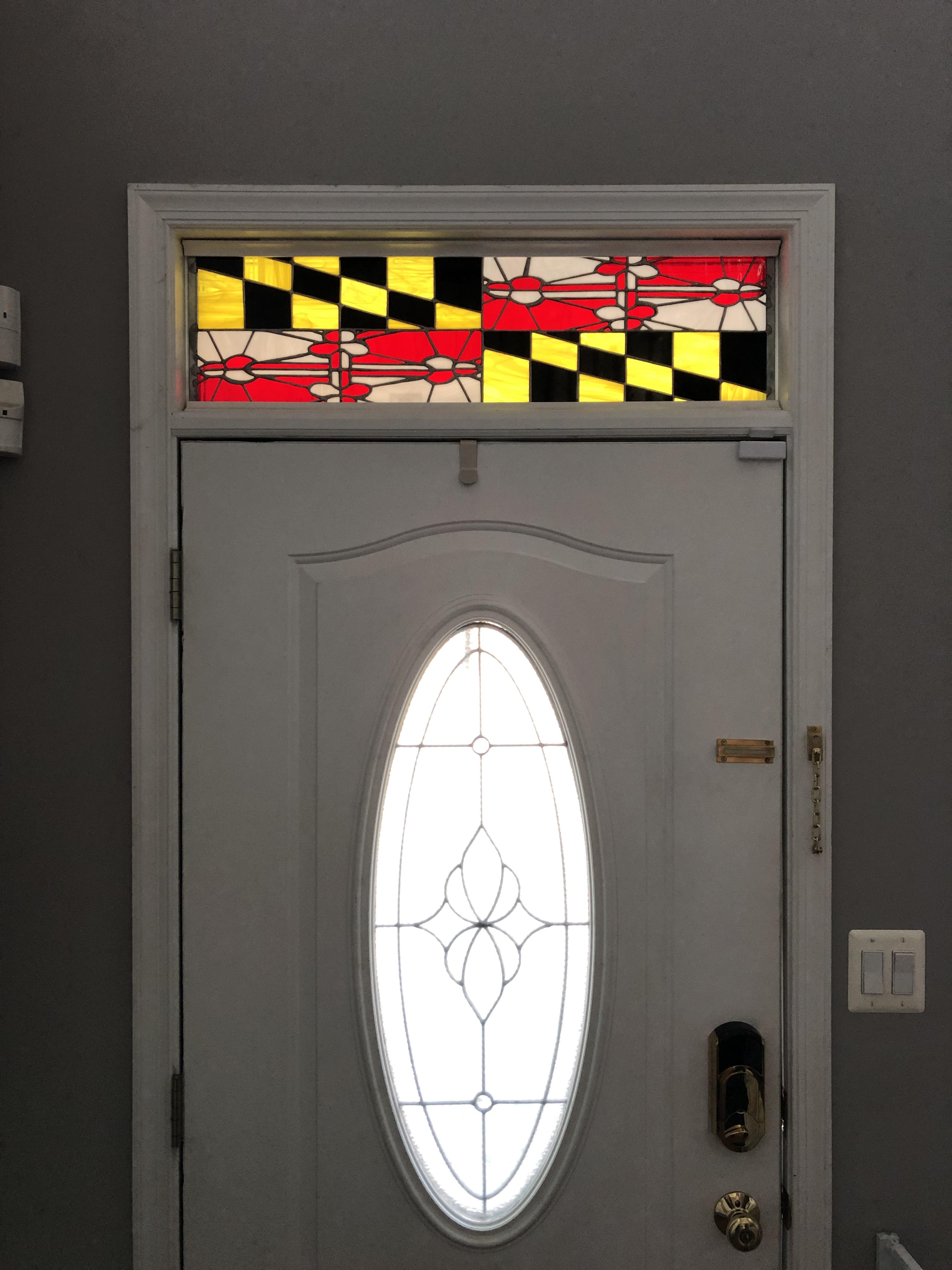 A friend of mine made this stained glass MD flag panel for our front