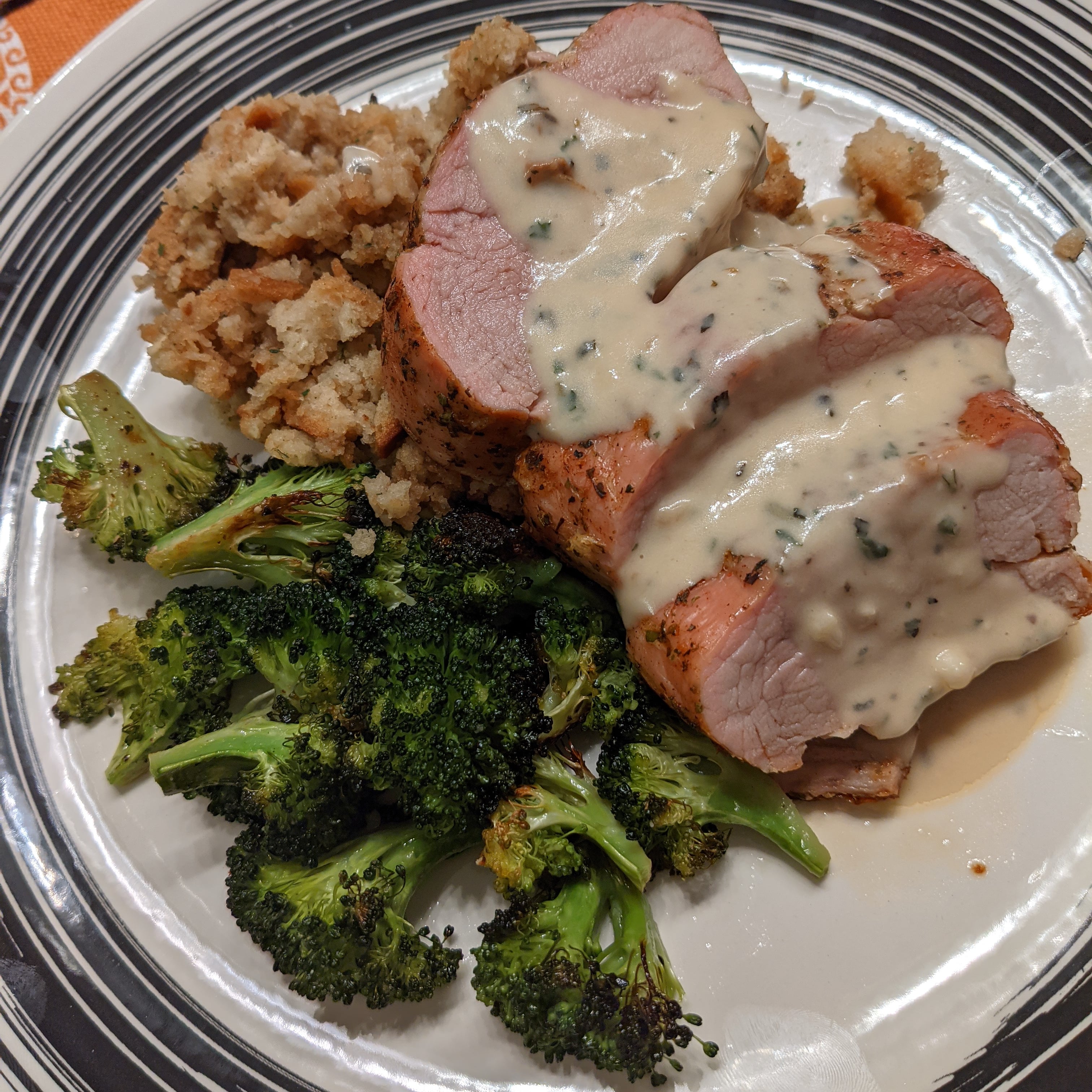 Roasted garlic and herb pork tenderloin with roasted broccoli, boxed stuffing and a quick herb