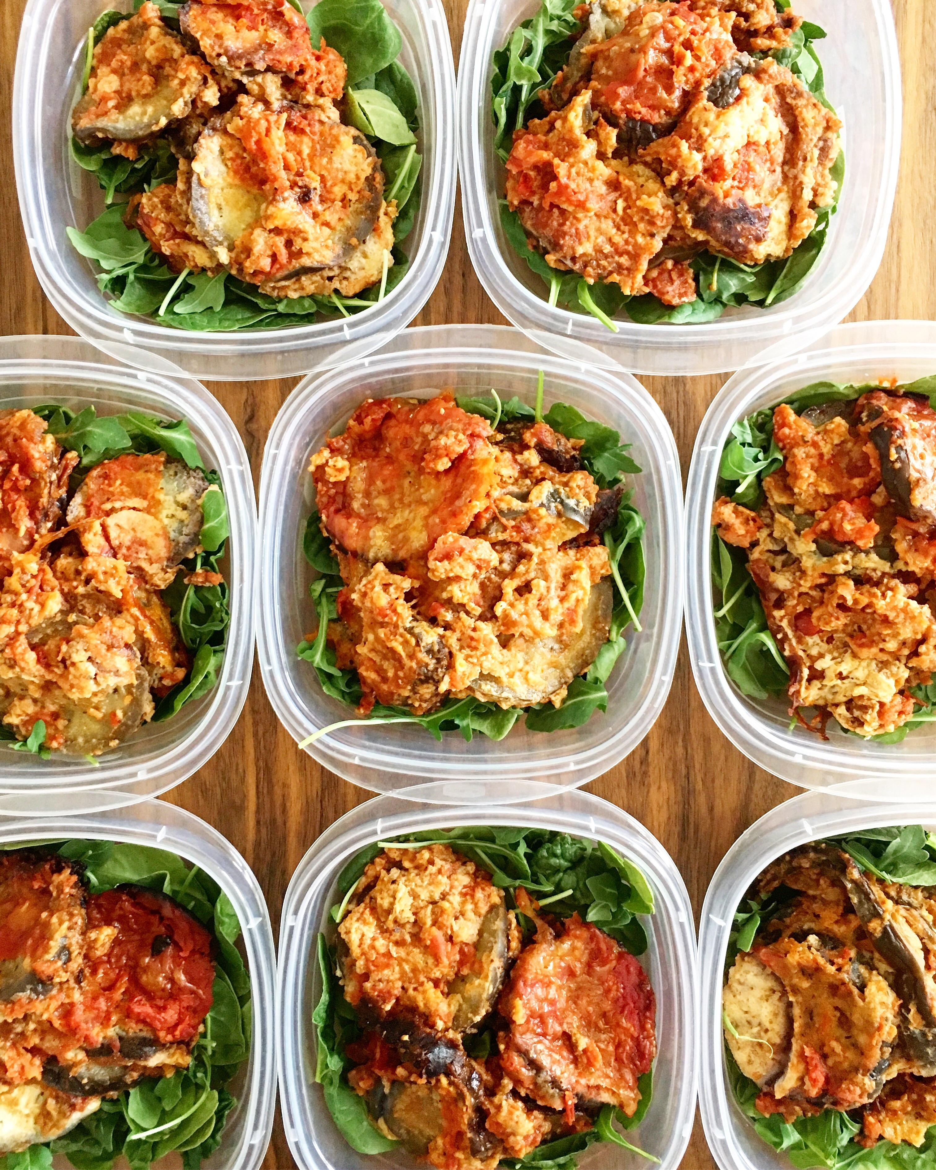 Slow Cooker Eggplant Parmesan on a bed of Spinach & Arugula for lunches