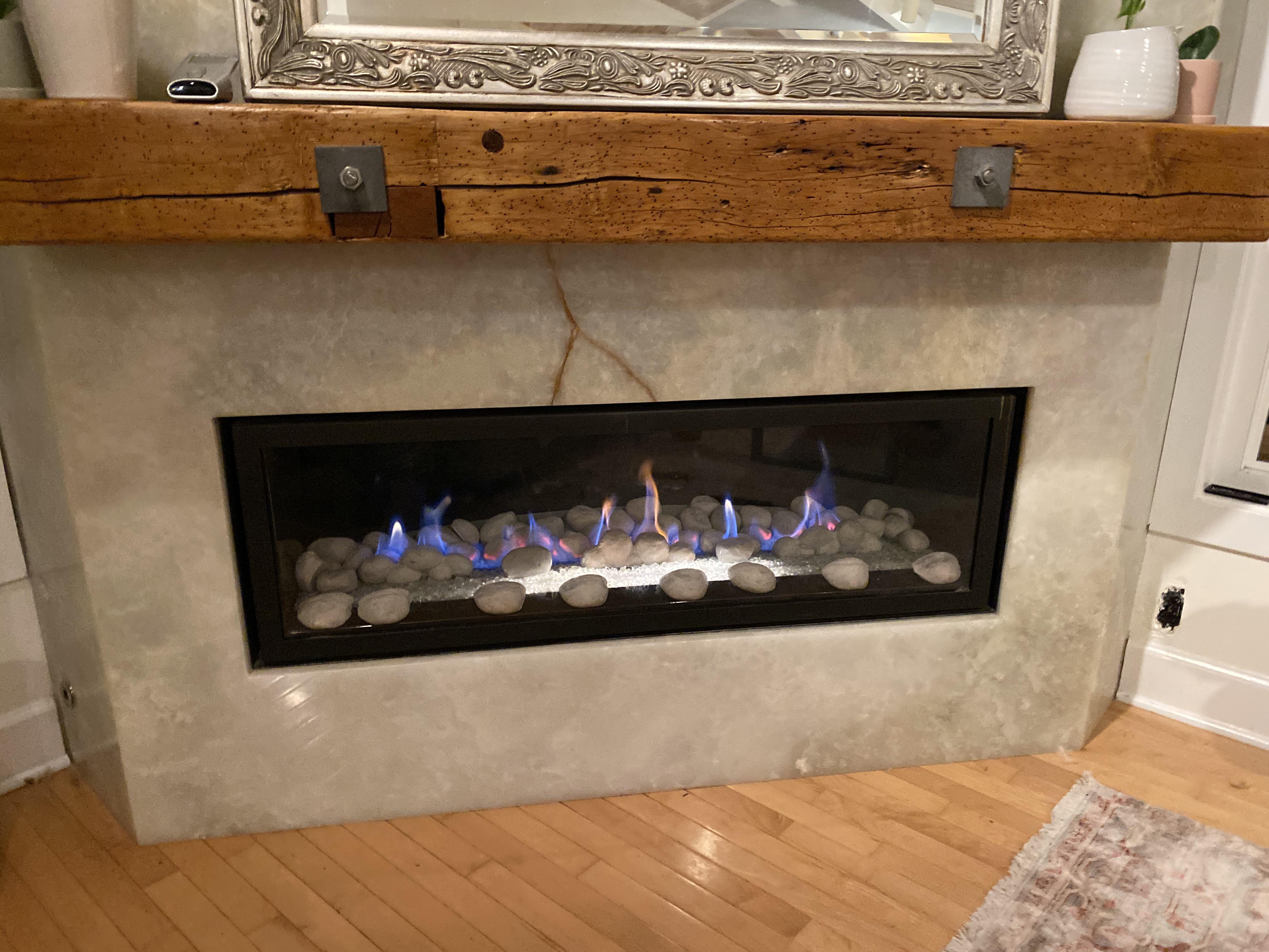 Where do I find the thermocouple on this fireplace? The flames start