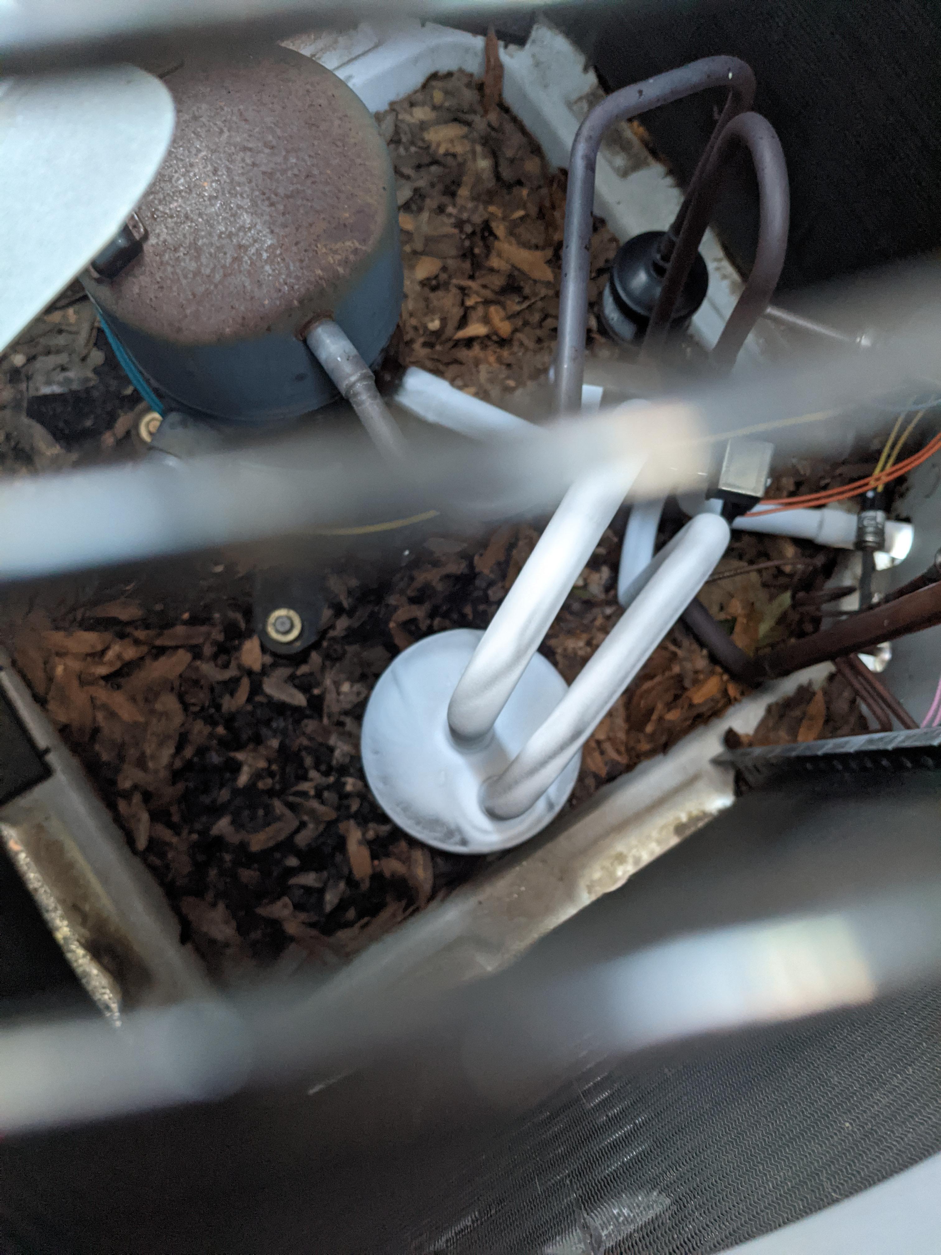 Heat pump not heating house. Unit will run continuously and this part freezes over. Outside temp