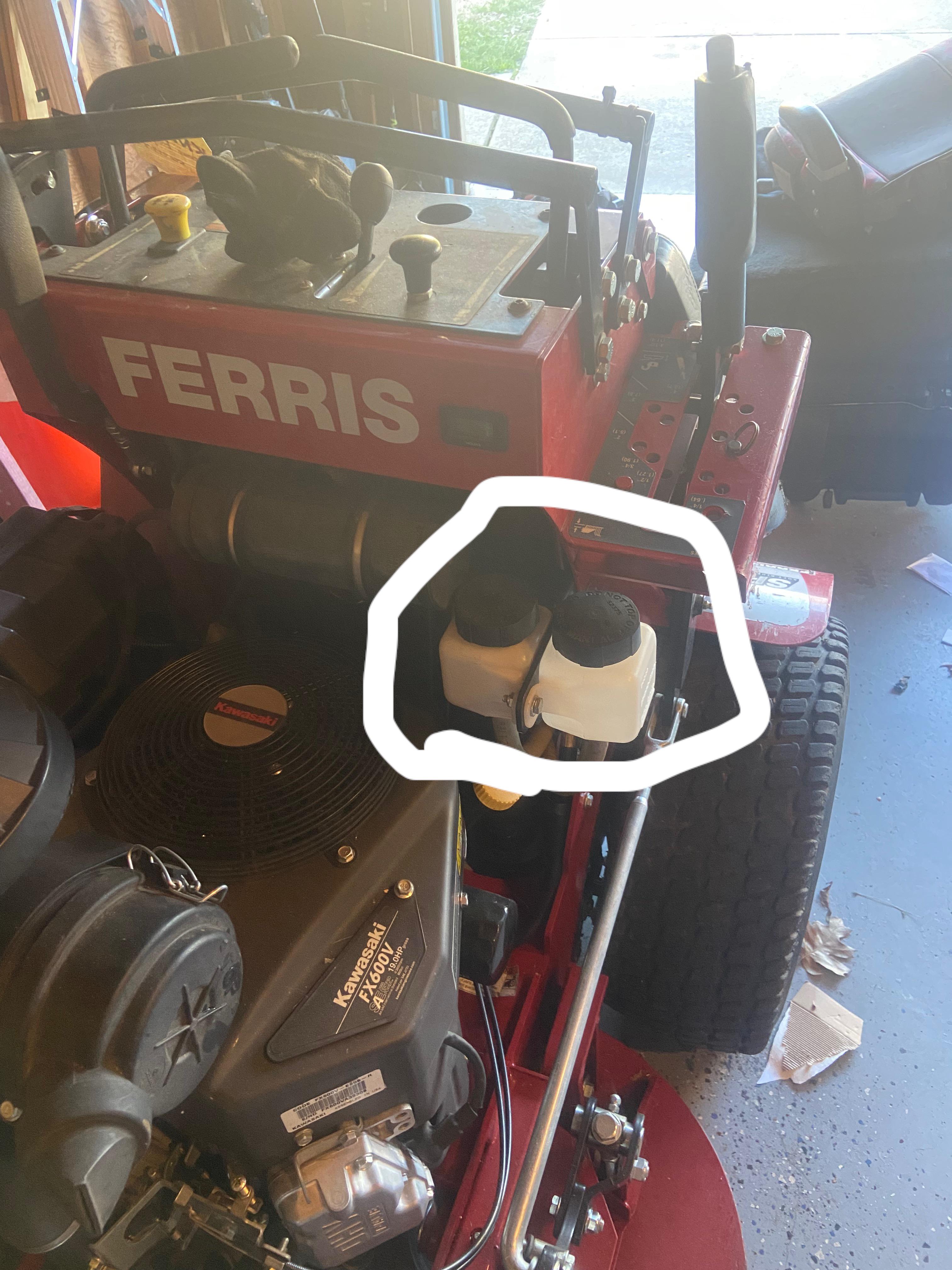 What goes in these Ferris reservoirs ? Oil? r/lawnmowers