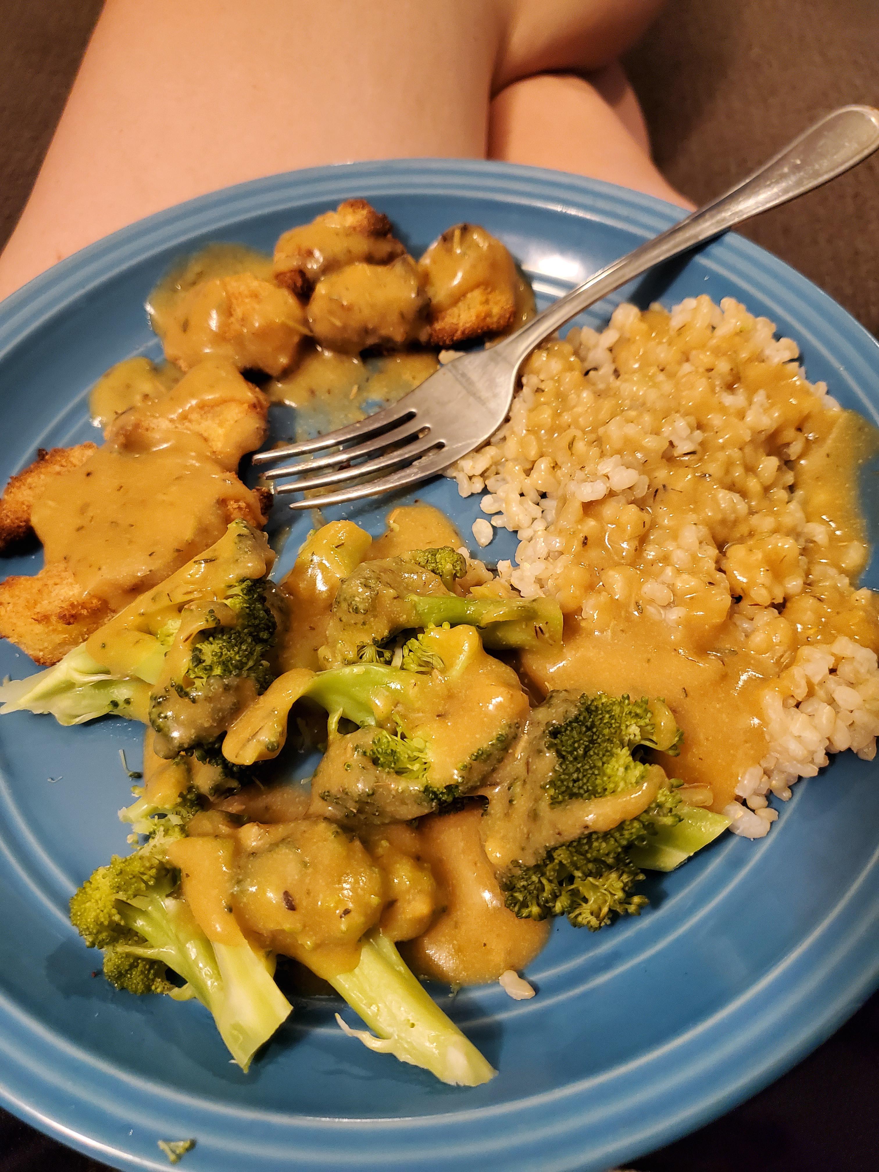 Breaded cauliflower steaks, brown rice, broccoli, and brown gravy. r