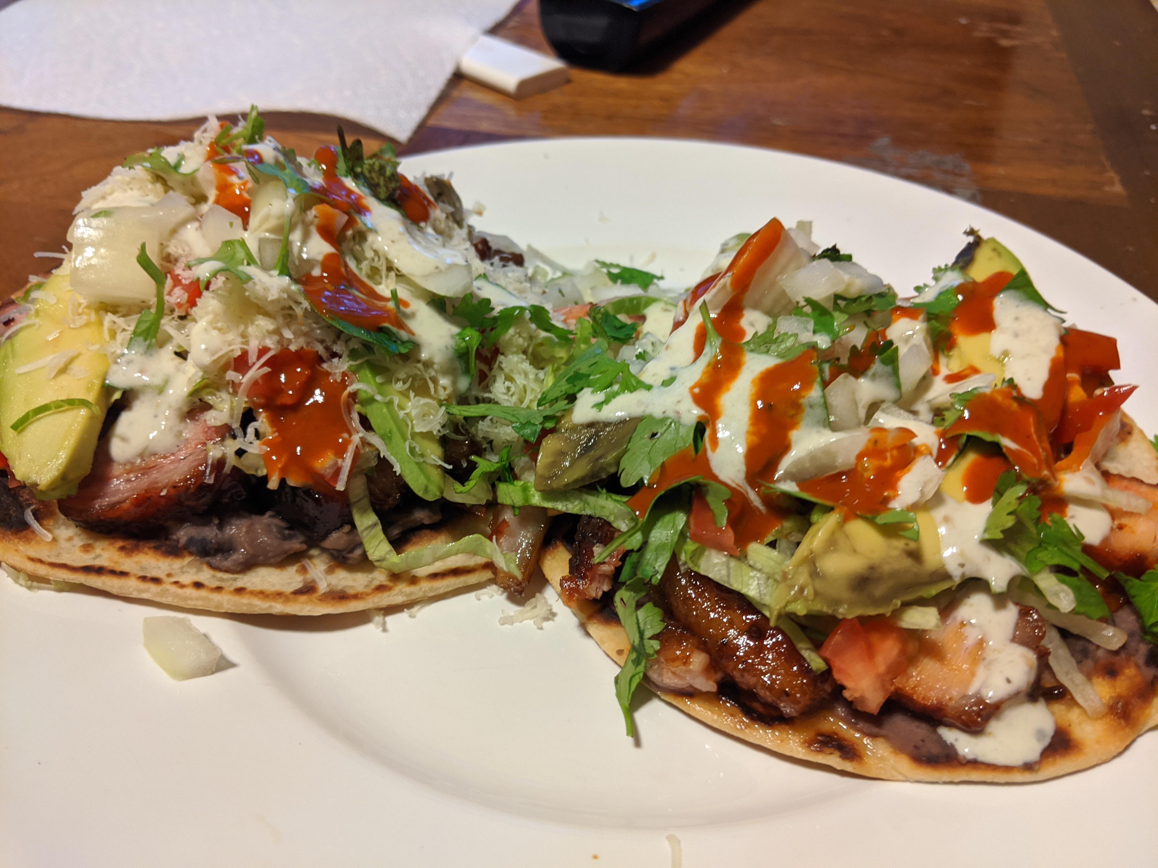 Smoked pork belly "tostadas" belly, refried beans, lettuce, tomato