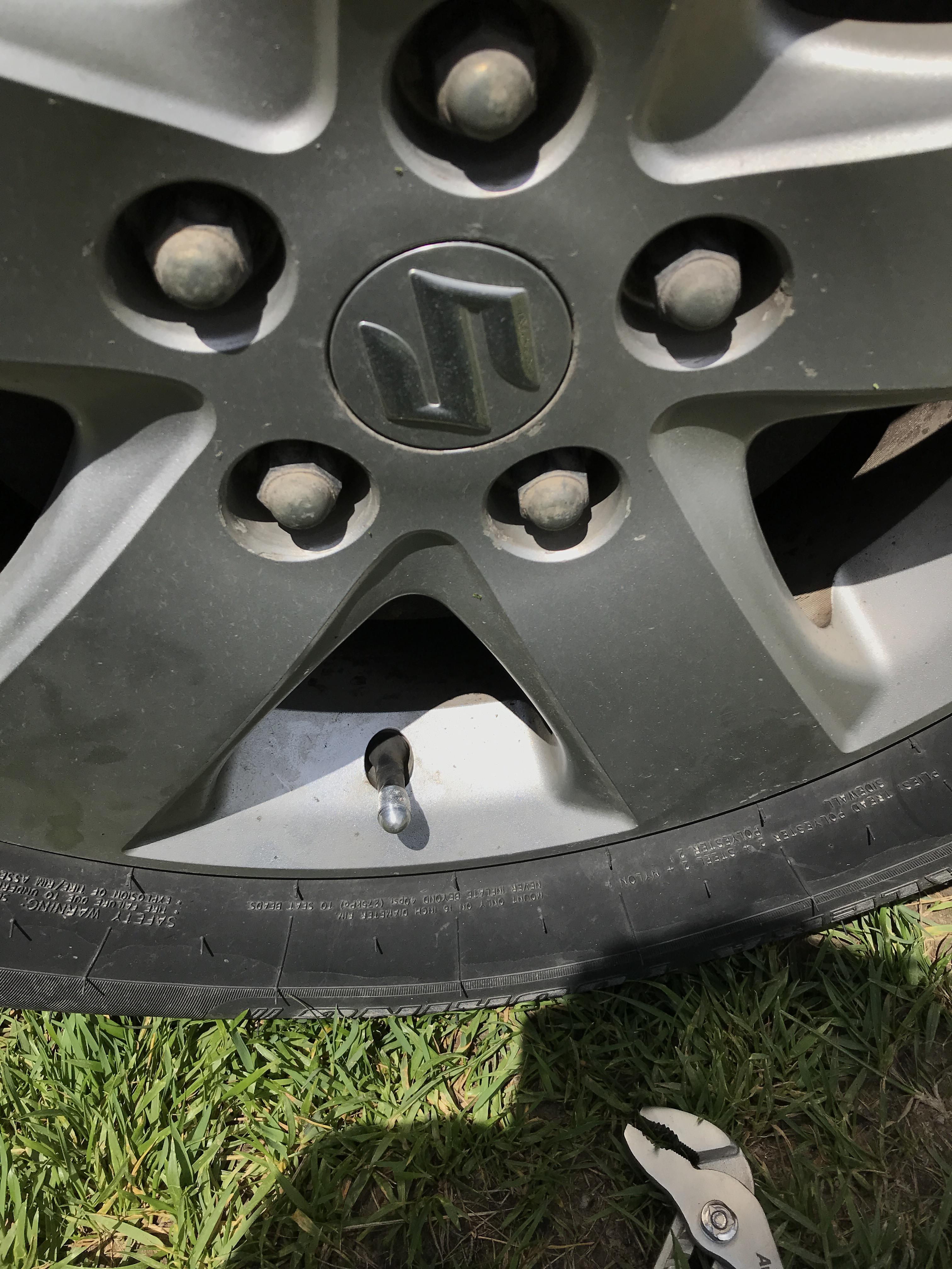 Cap is stuck on tire. Any ideas? r/fixit