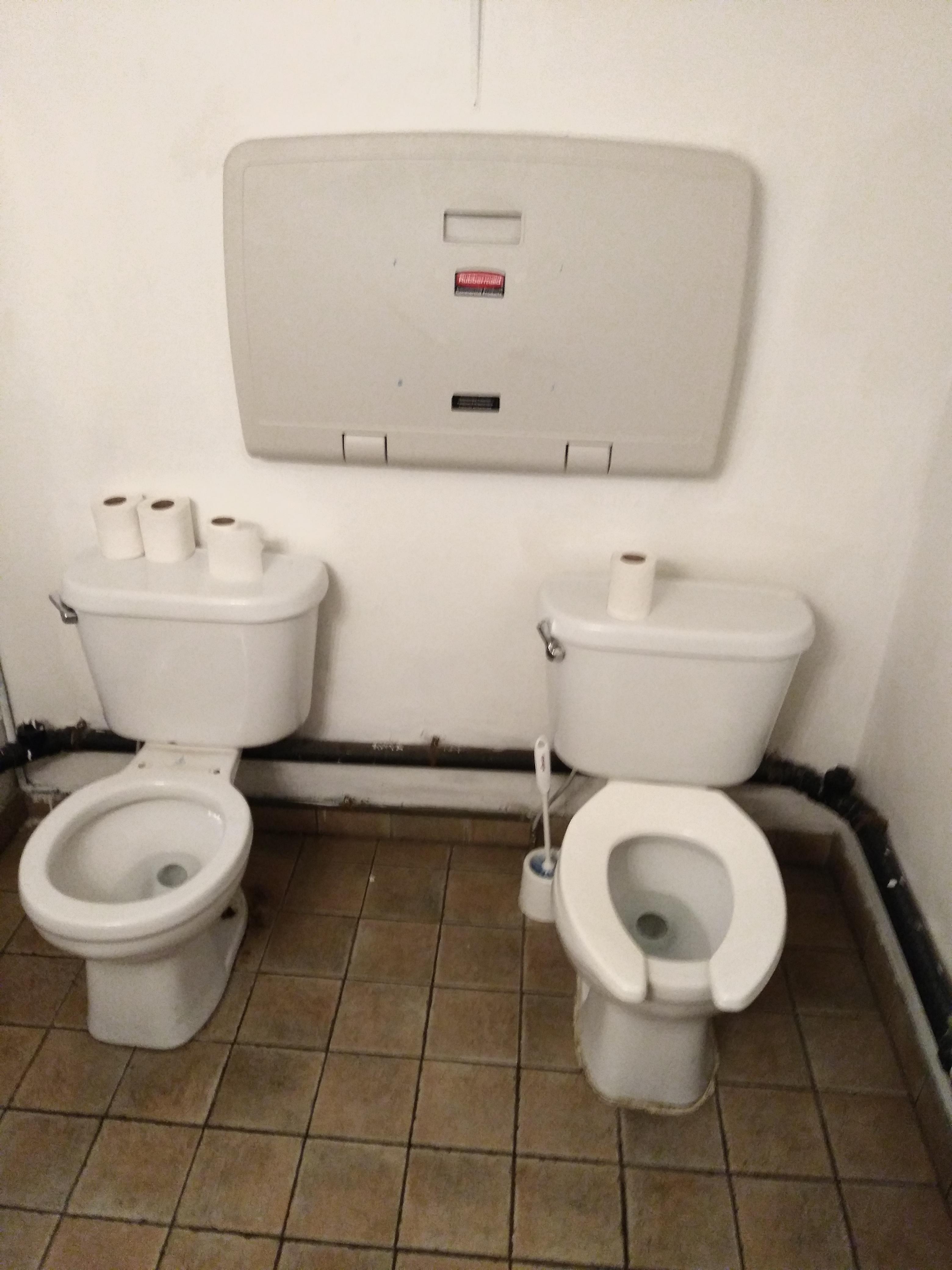 The bathroom at a local cafe. In case you need to bring a friend? r