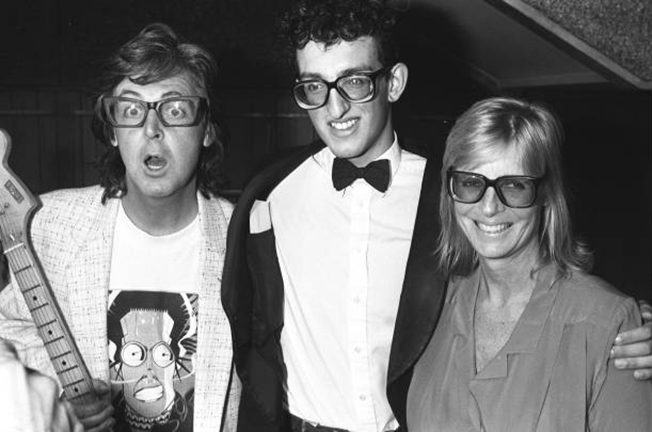 A photo of Paul with a buddy holly impersonator r/beatles