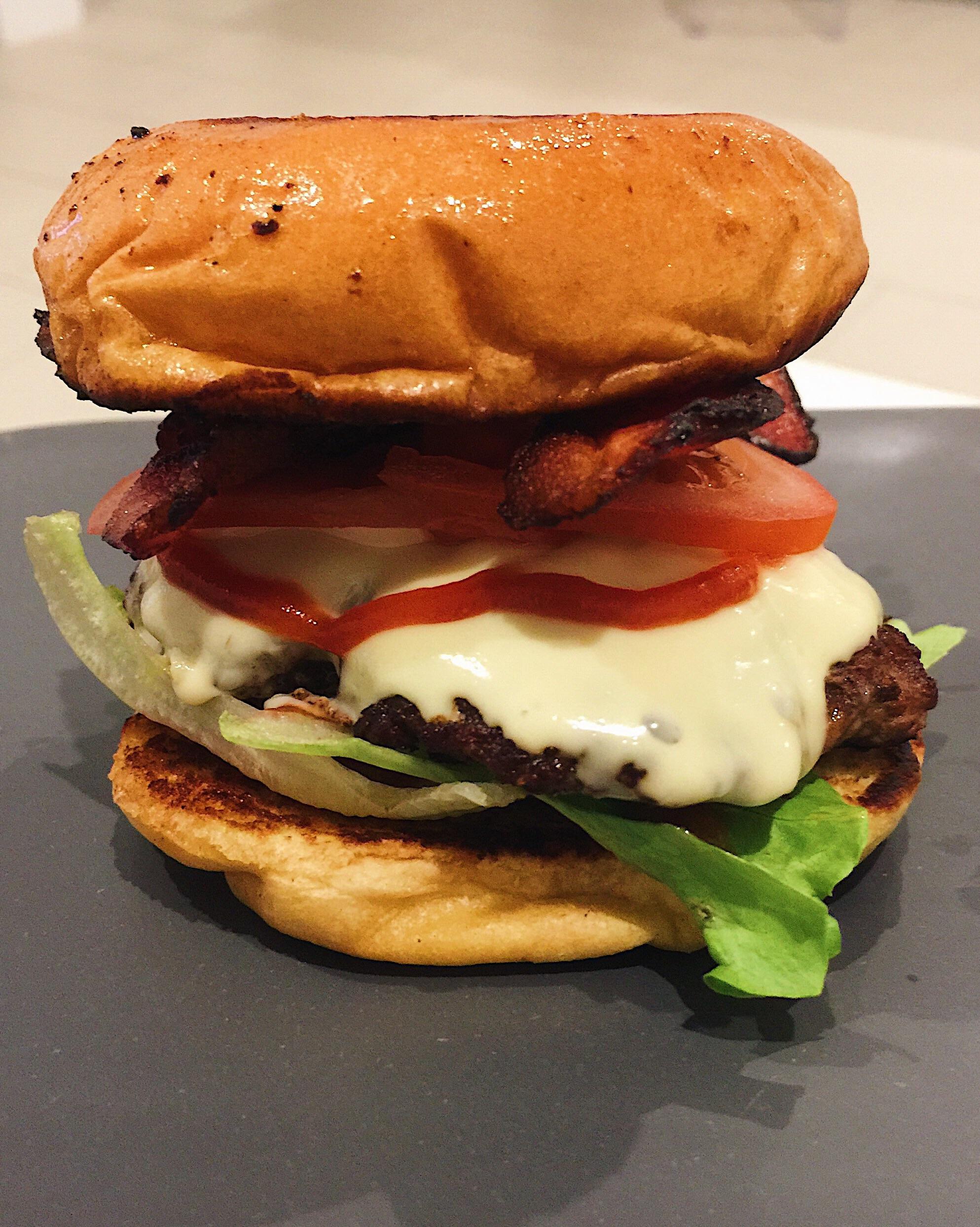 Home Made Smashed beef burger! Toasted brioche bun, cheese, lettuce