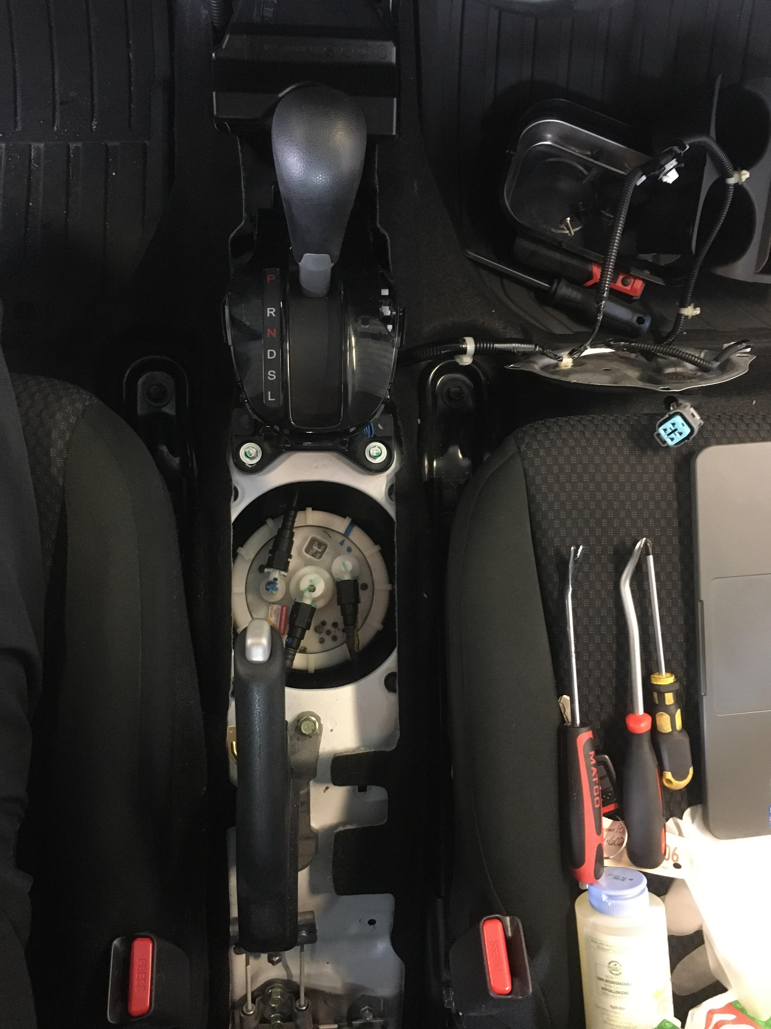 2019 Honda Fit fuel pump located underneath the center console. r