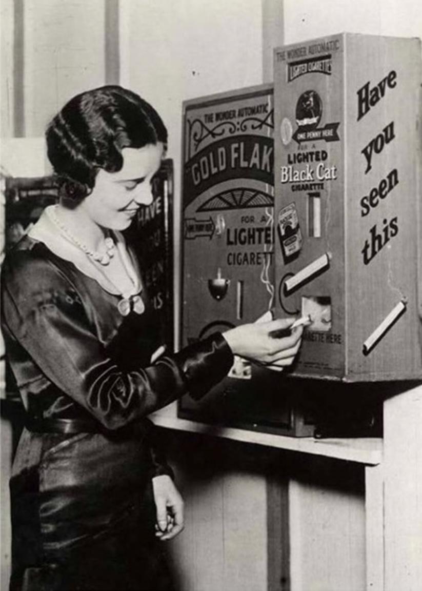 A vending machine that sold already lit cigarettes for a penny, England