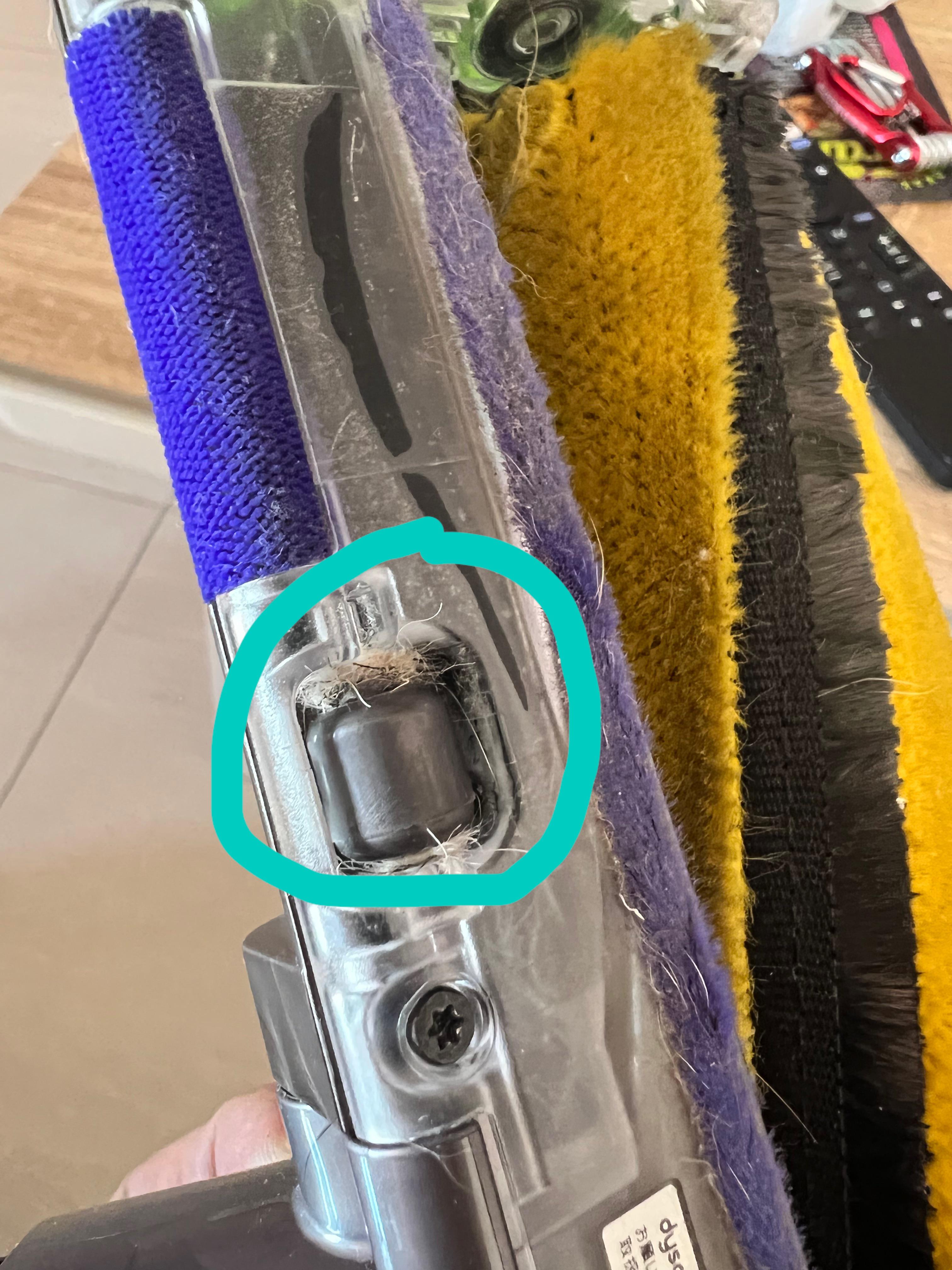 How can I remove fur/hair from these little wheels? (Dyson soft roller