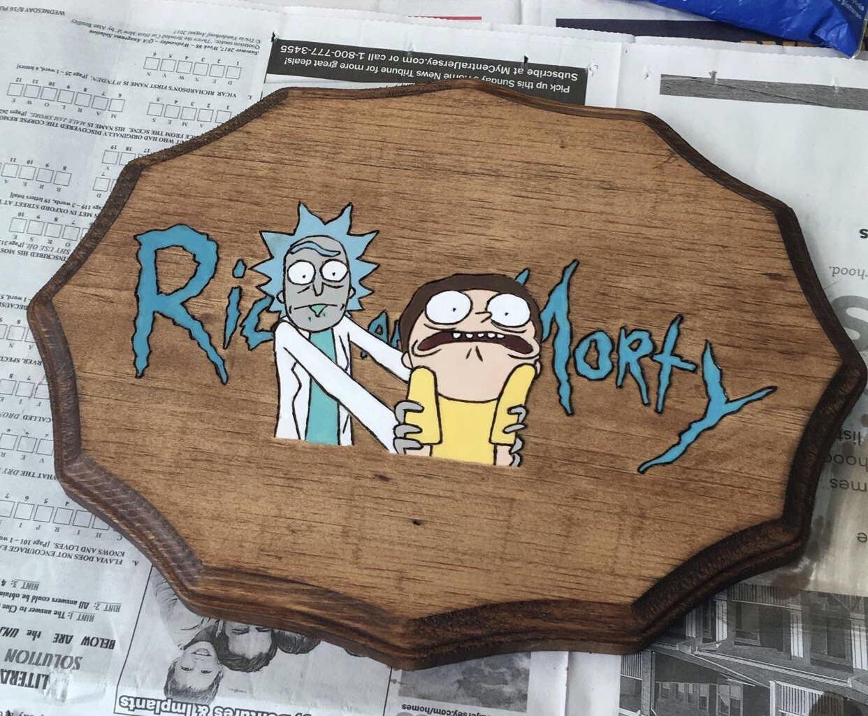 Buddy wood burned and painted this up today r/rickandmorty