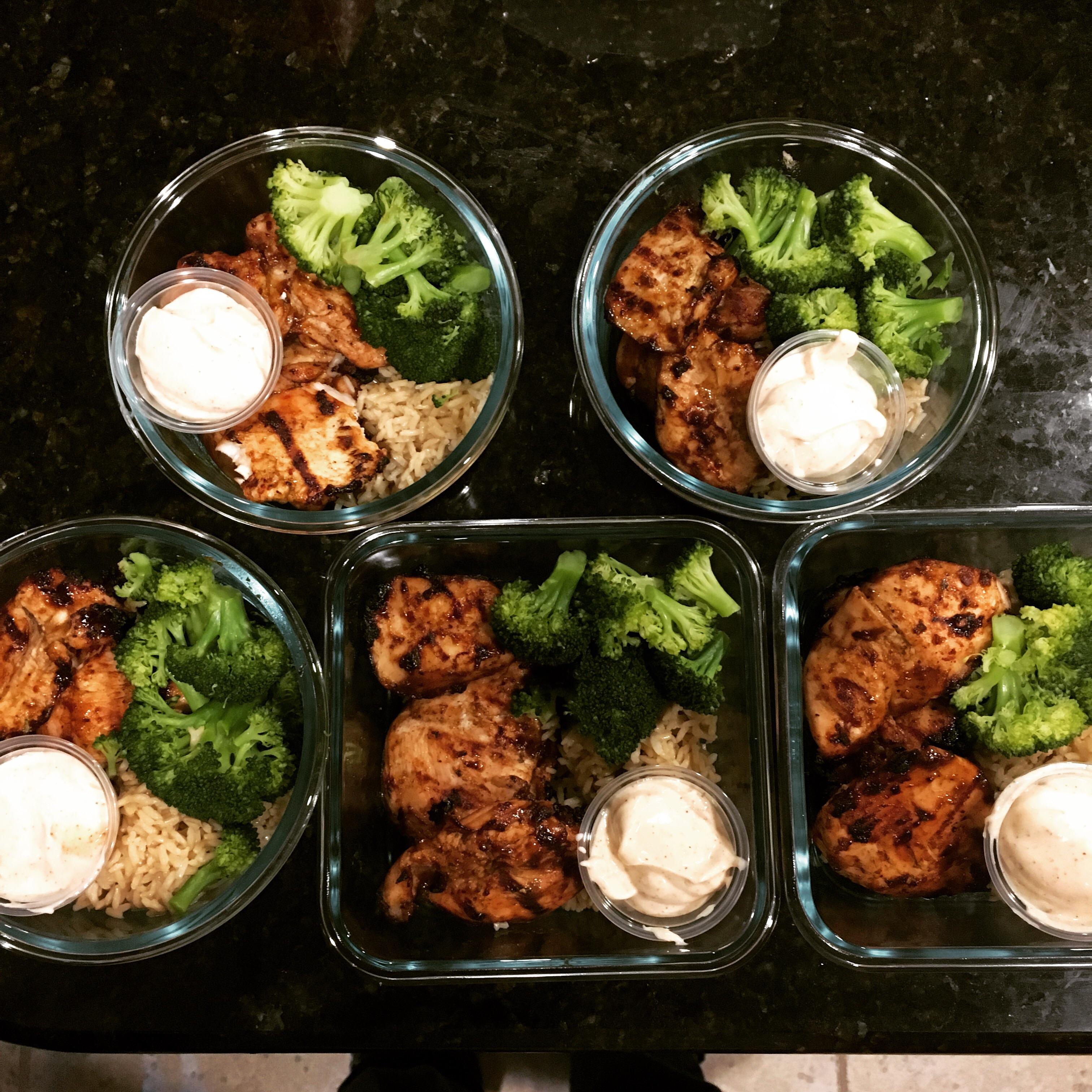 Jerk chicken, steamed broccoli, brown rice and a yogurt sauce r