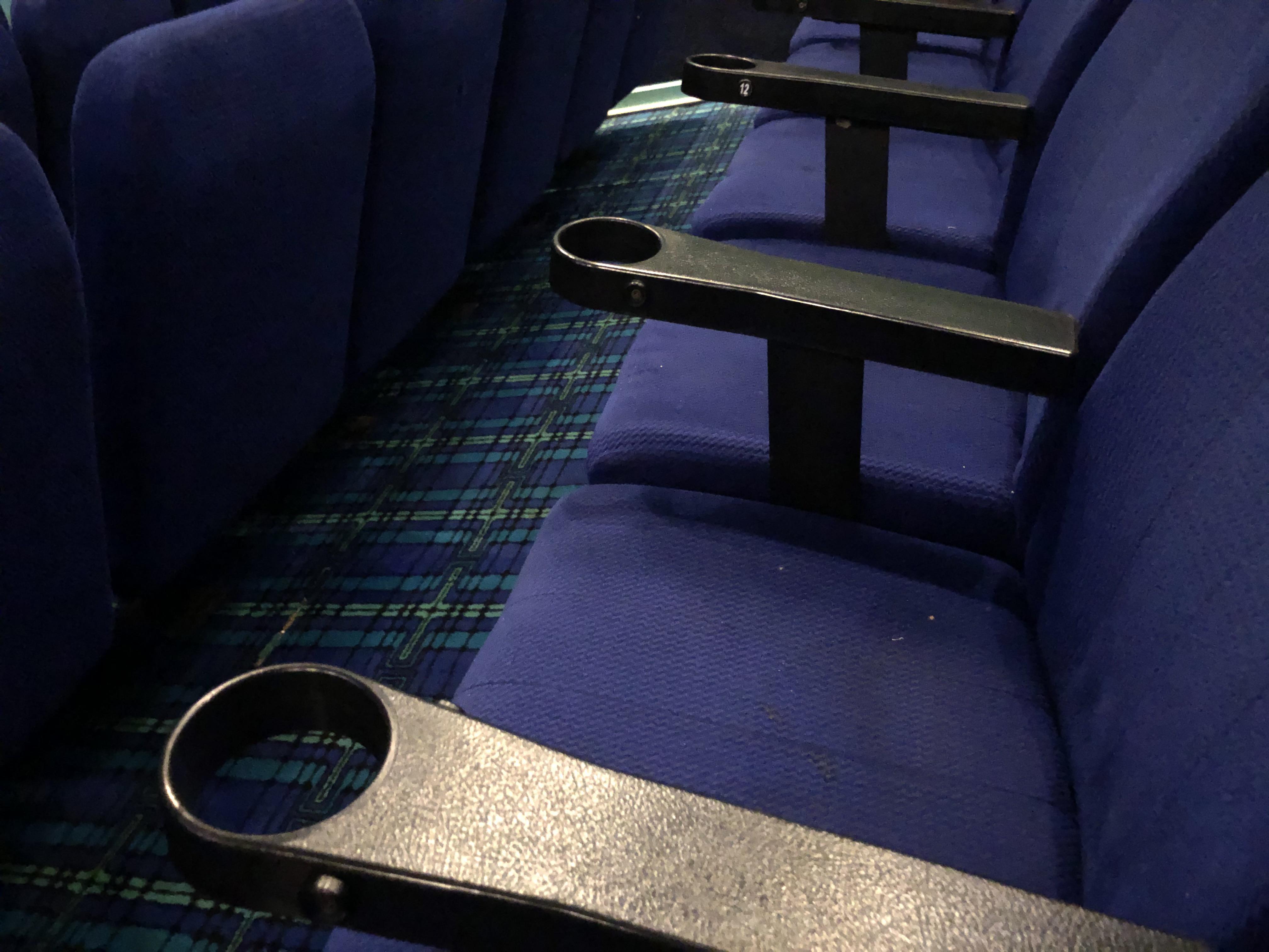 These cinema cup holders with no bottoms so they only fit their super