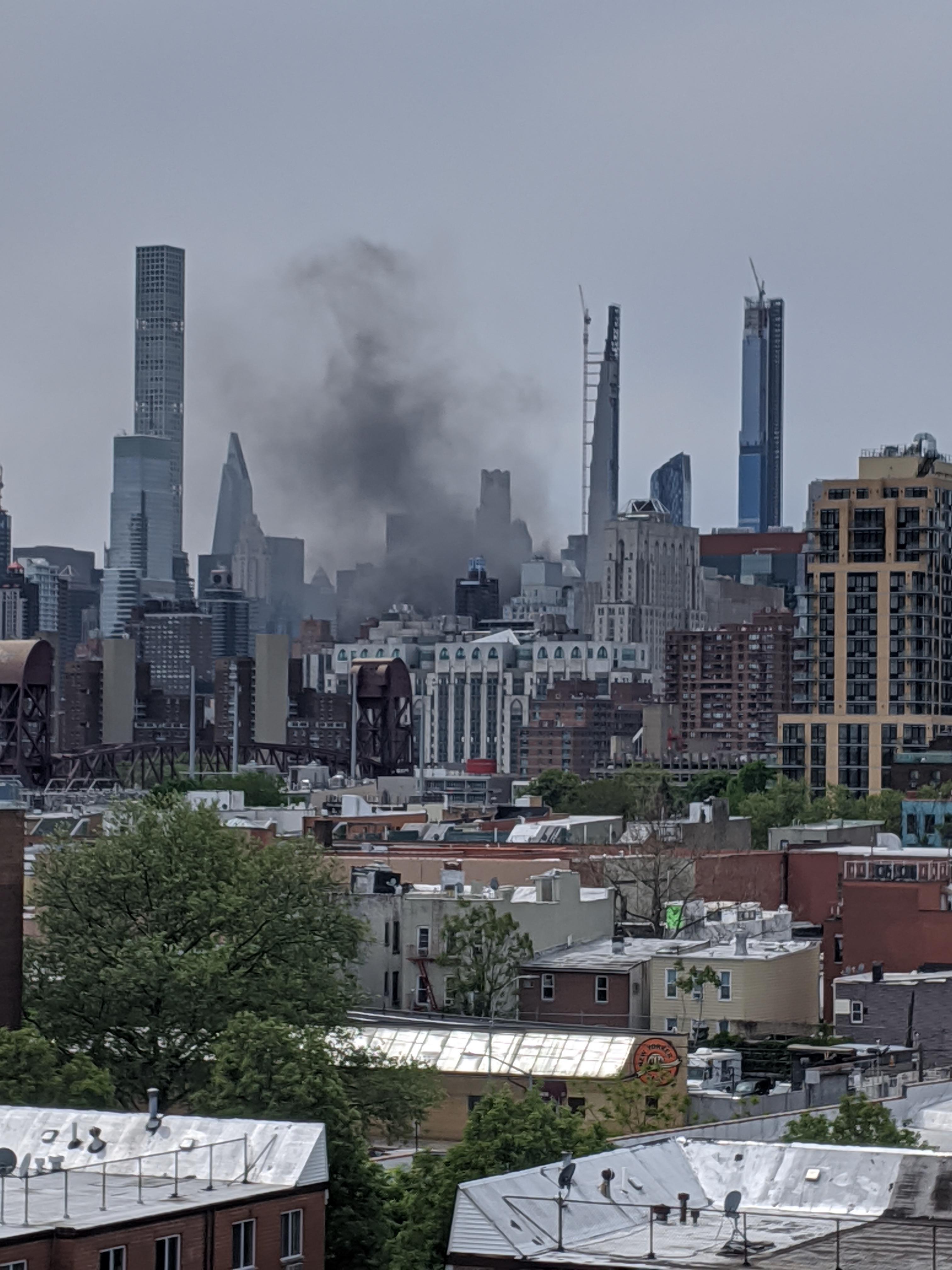 Smoke over midtown Manhattan seen from astoria, is there something