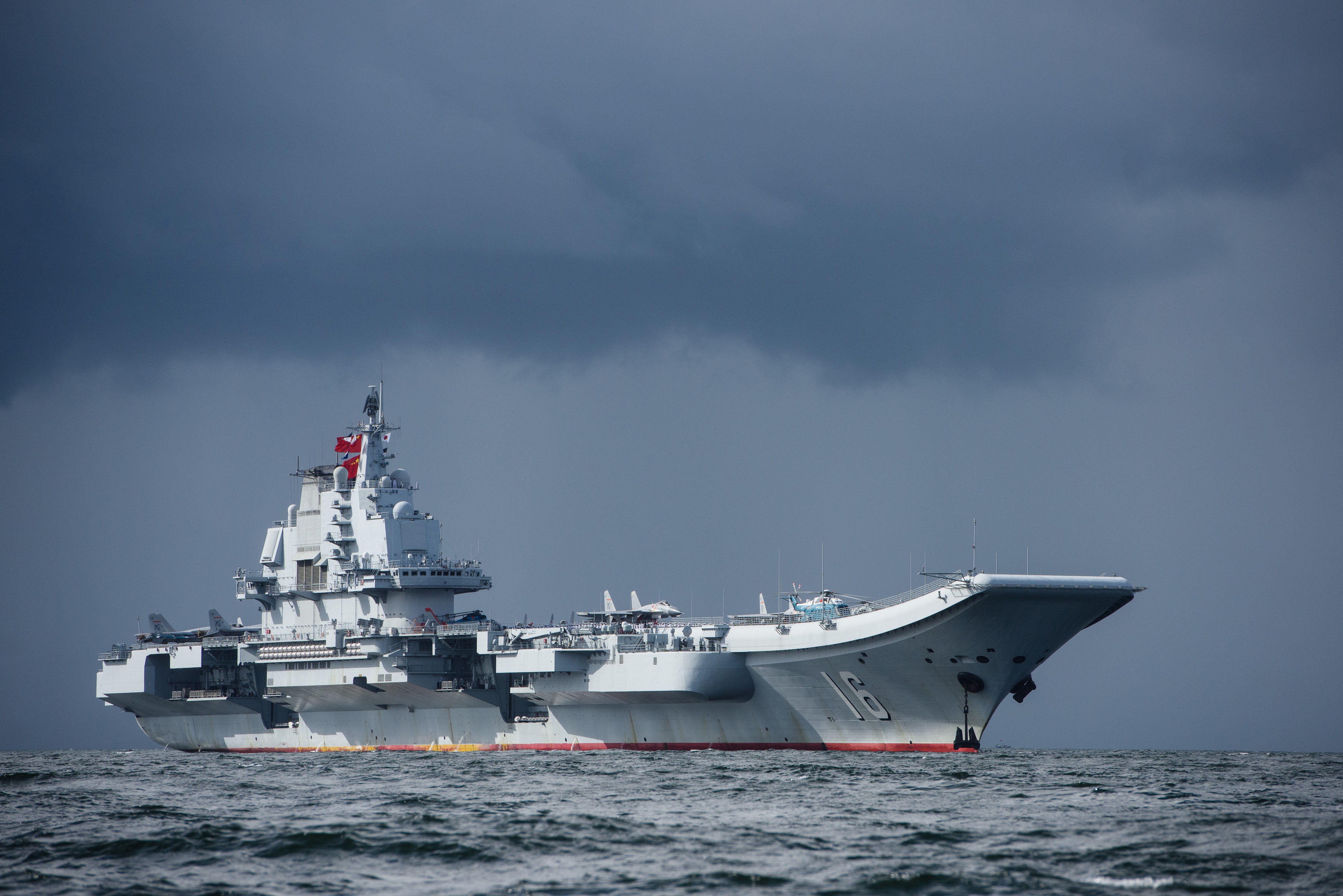 Chinese aircraft carrier Liaoning departing Hong Kong harbour.[4760 ×