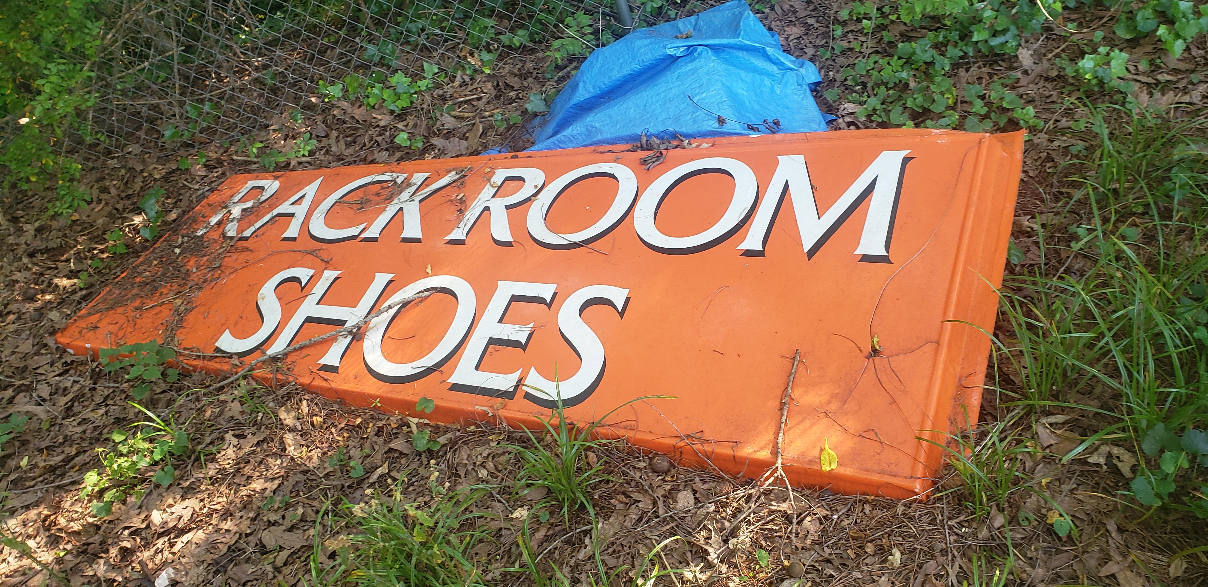 Found this giant rack room shoes sign behind my shed r/mildlyinteresting