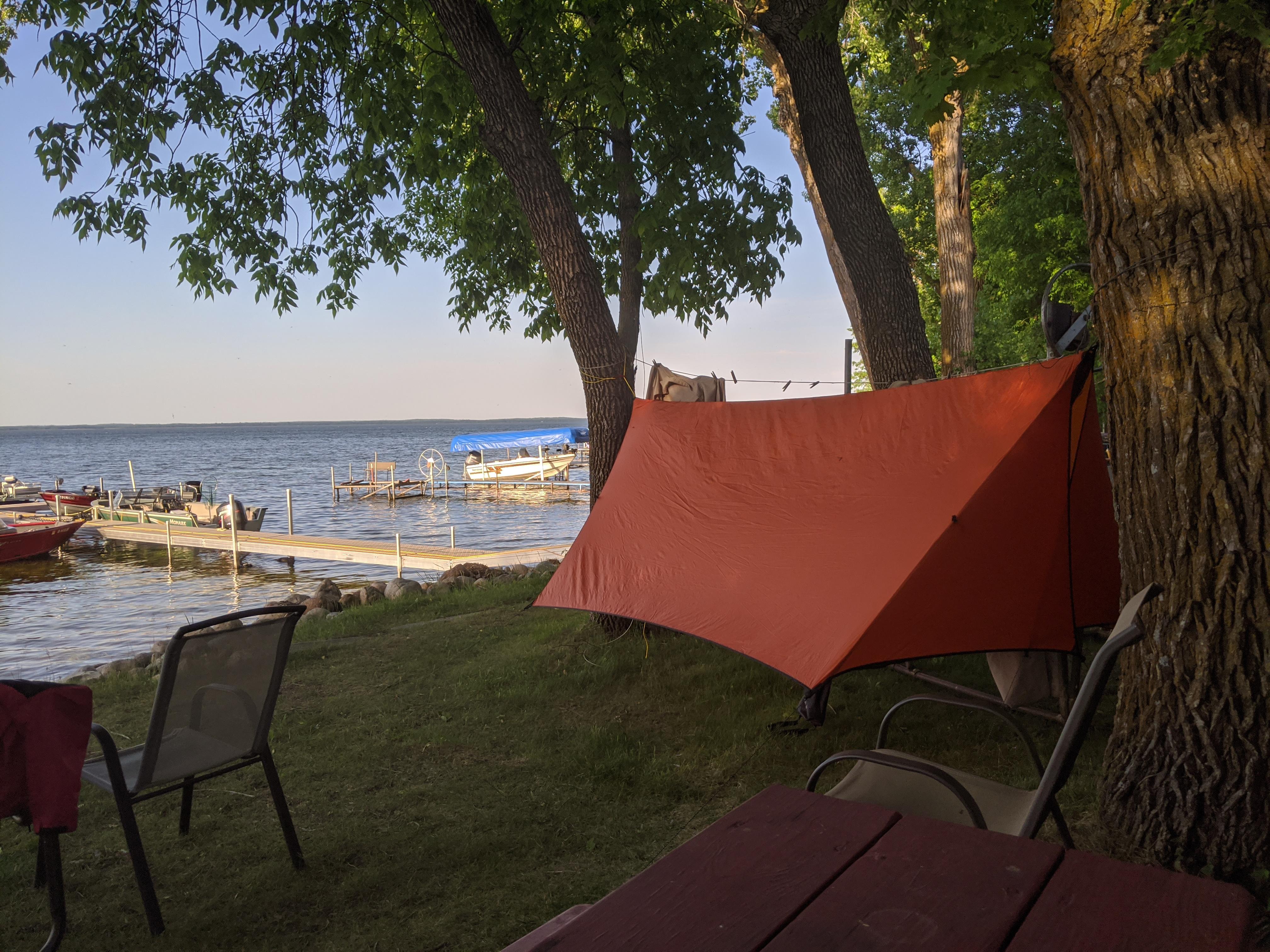 Who needs cabins at a resort when you have trees and a hammock. Four