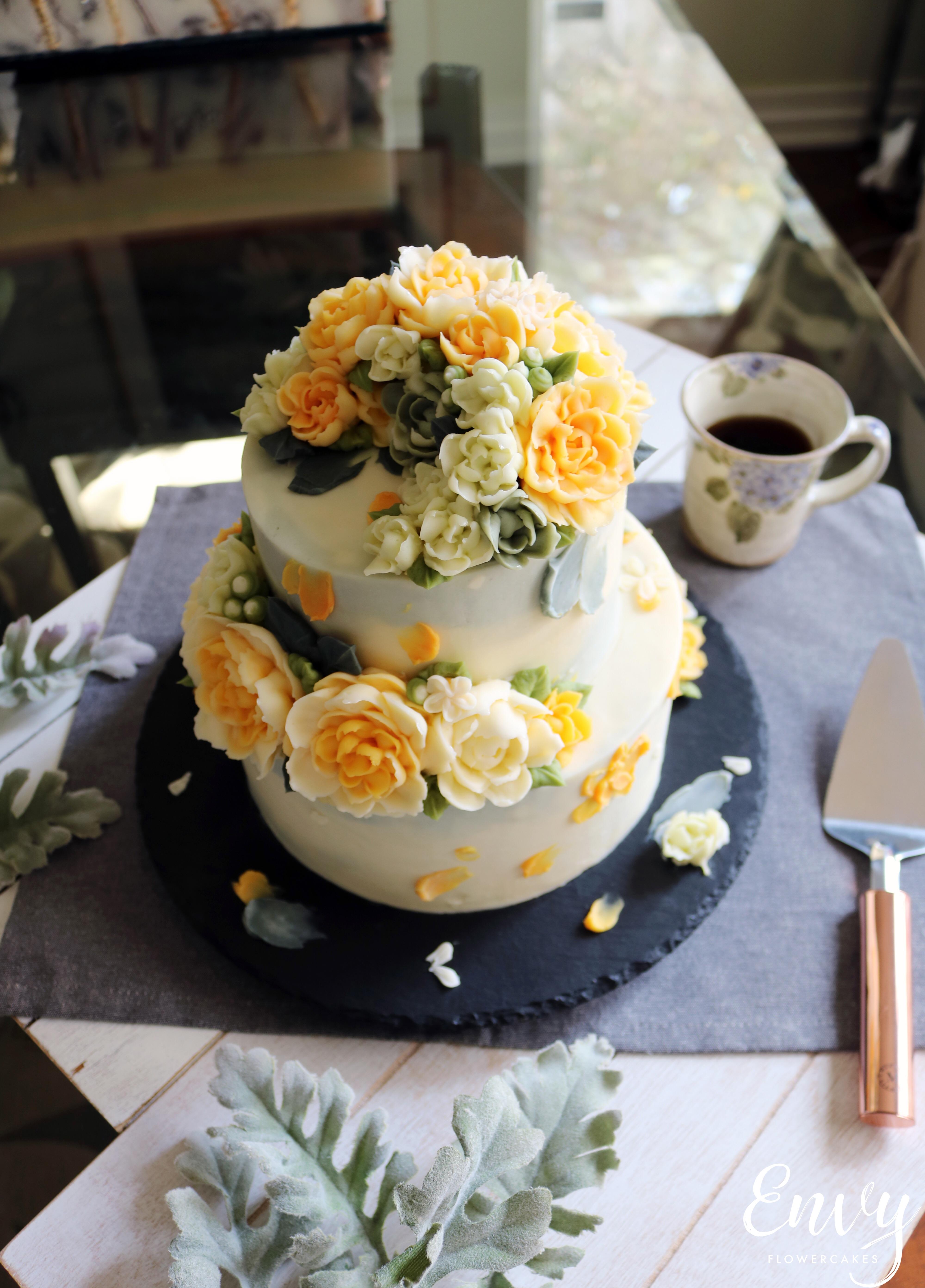 Lemon cake with buttercream flowers. Tried using spatula like palette