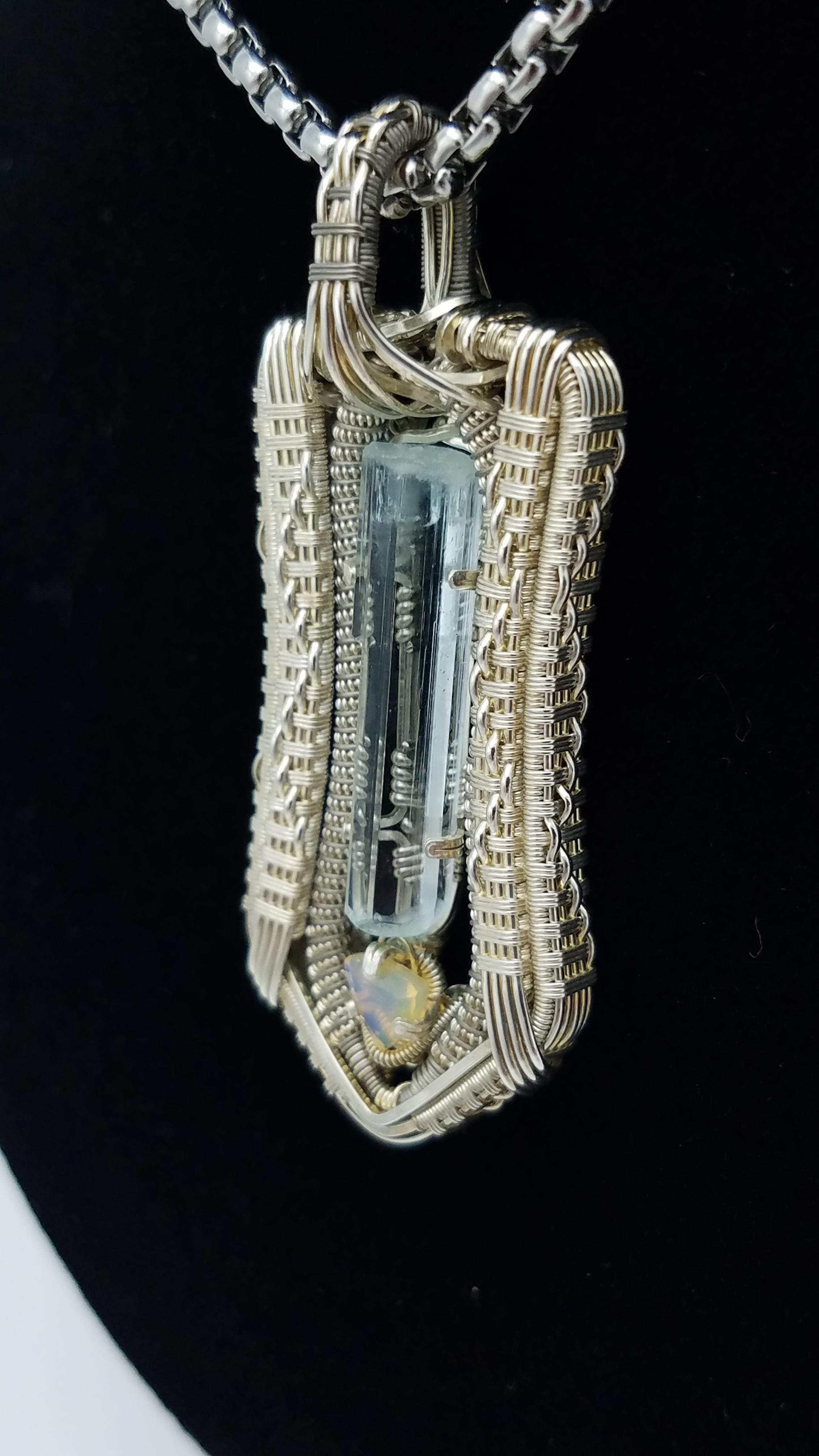 This piece was one of my first using titanium wire to accent silver. It