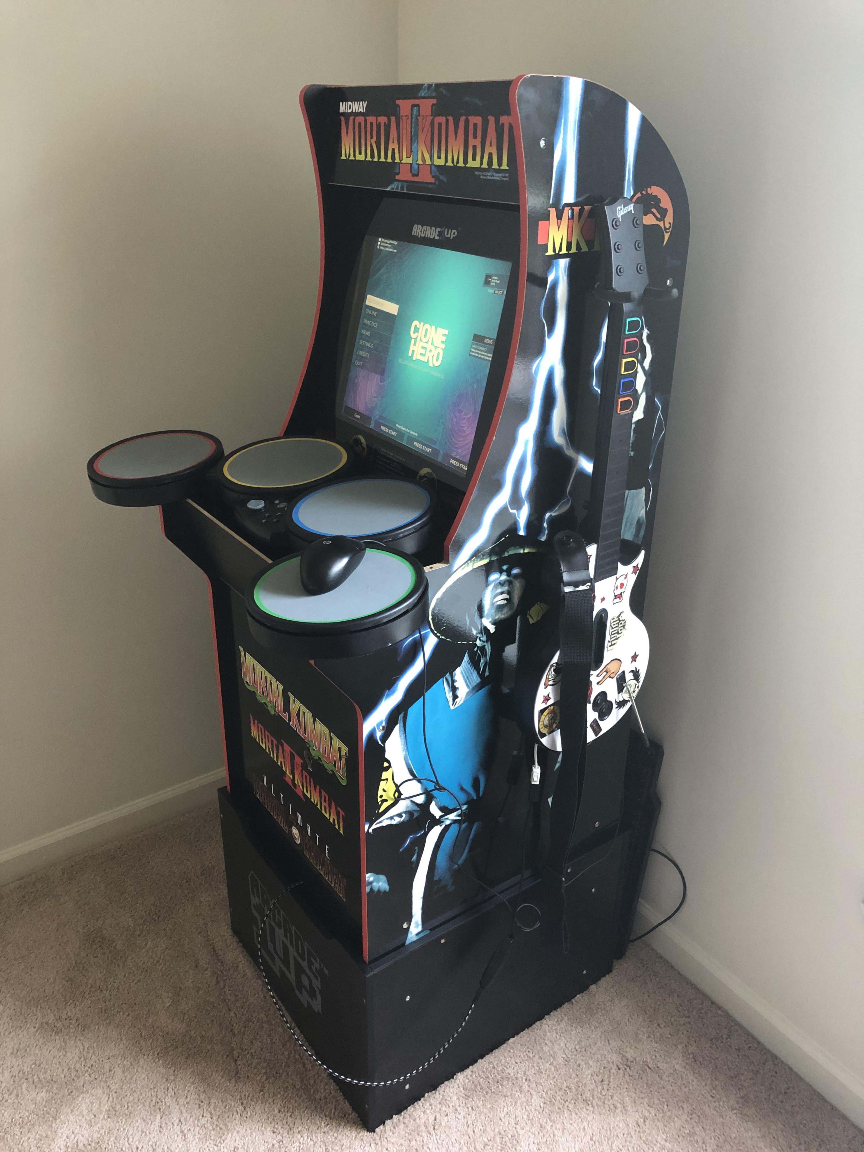 I was inspired by someone who posted their Clone Hero arcade machine