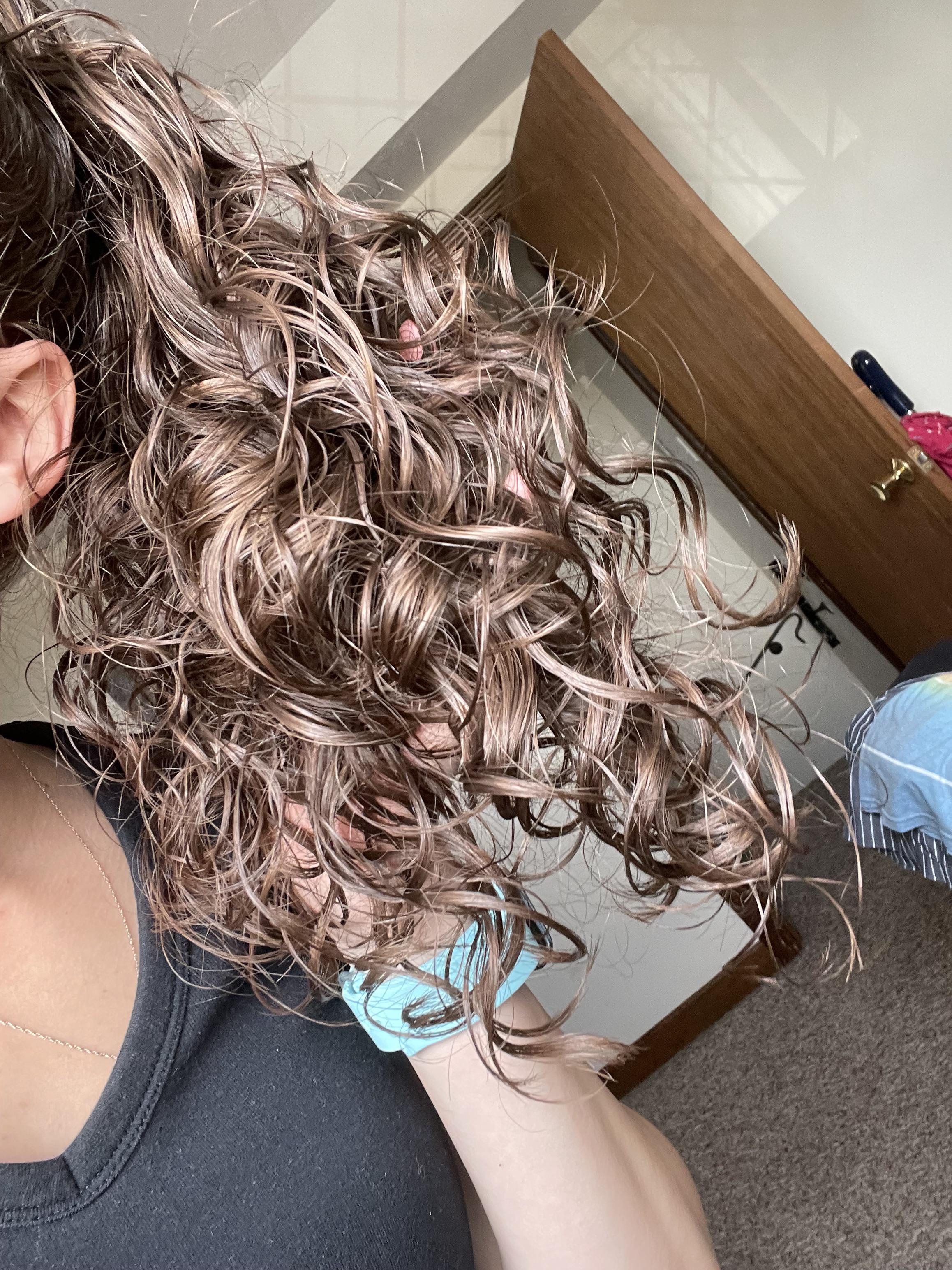 Finally figured out the best way to tie my hair up for work while letting my curls out to play