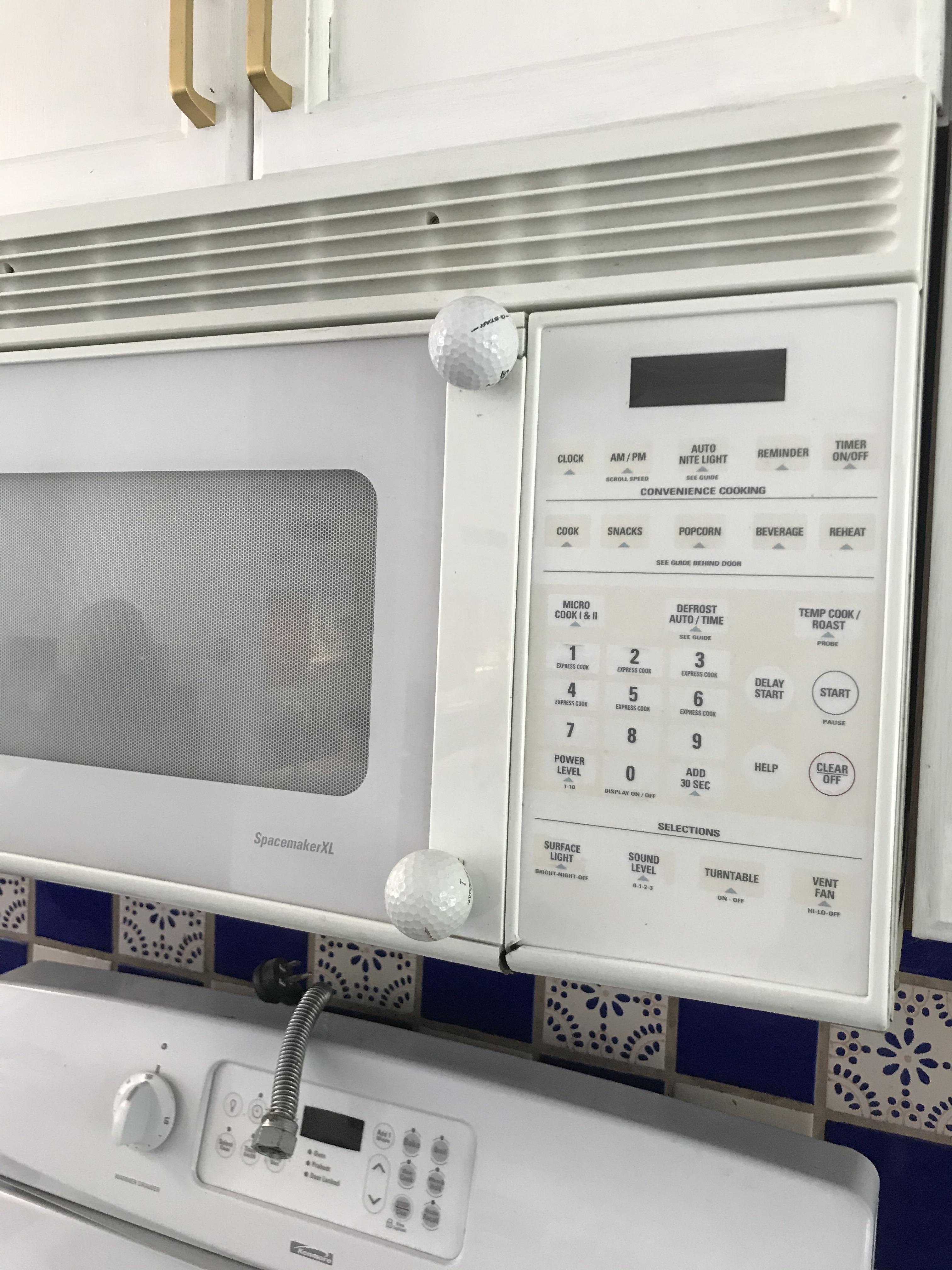 The old owners replaced their microwave handle with golf balls. 10/10