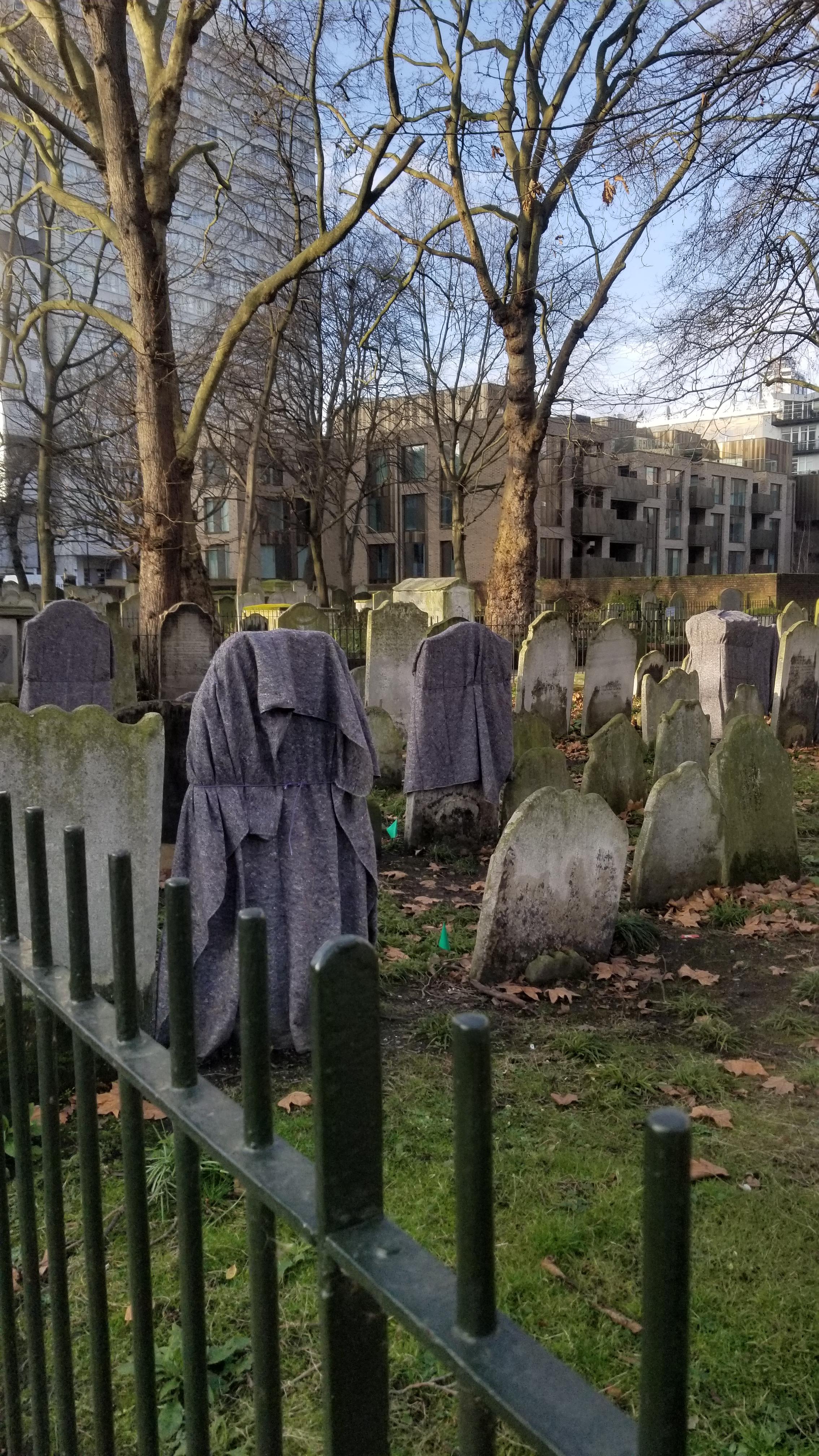 Any idea why these graves have blankets on them? Seen at Bunhill Field