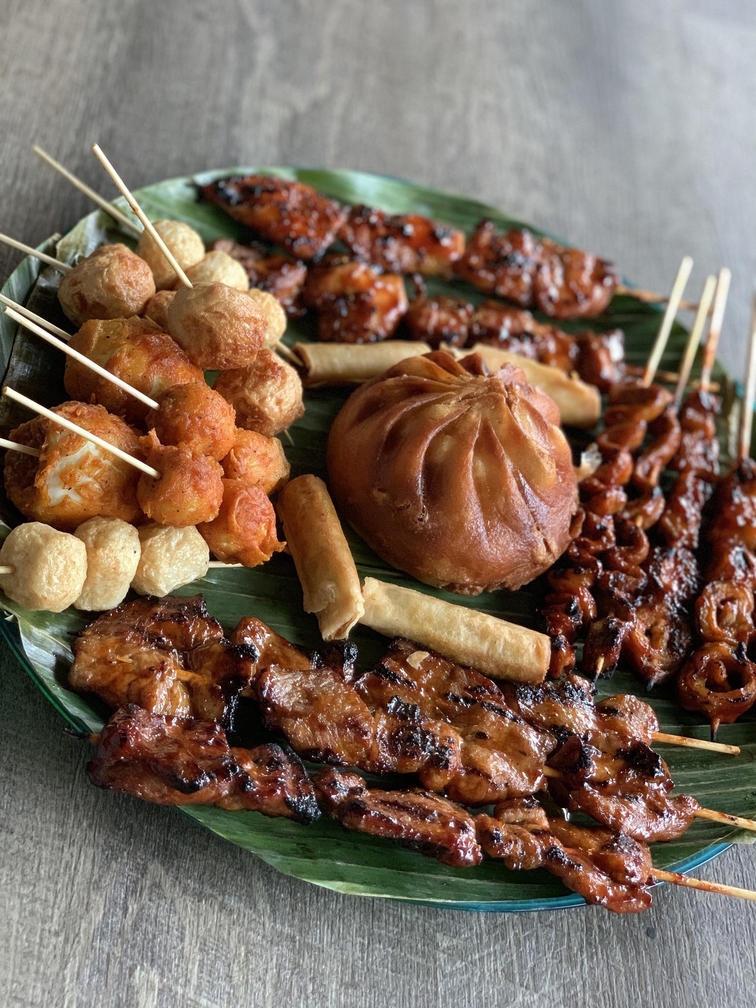 Filipino Party Platter BBQ chicken and Pork skewers, shrimp and fish