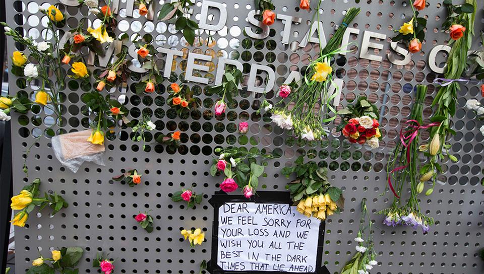 Local residents placed condolences and flowers on entrance of the US