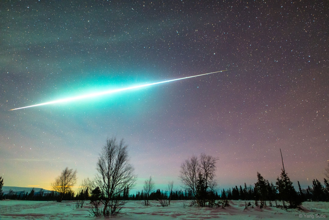 A bright Geminid Meteor moving through the sky in the Arctic. r/spaceporn