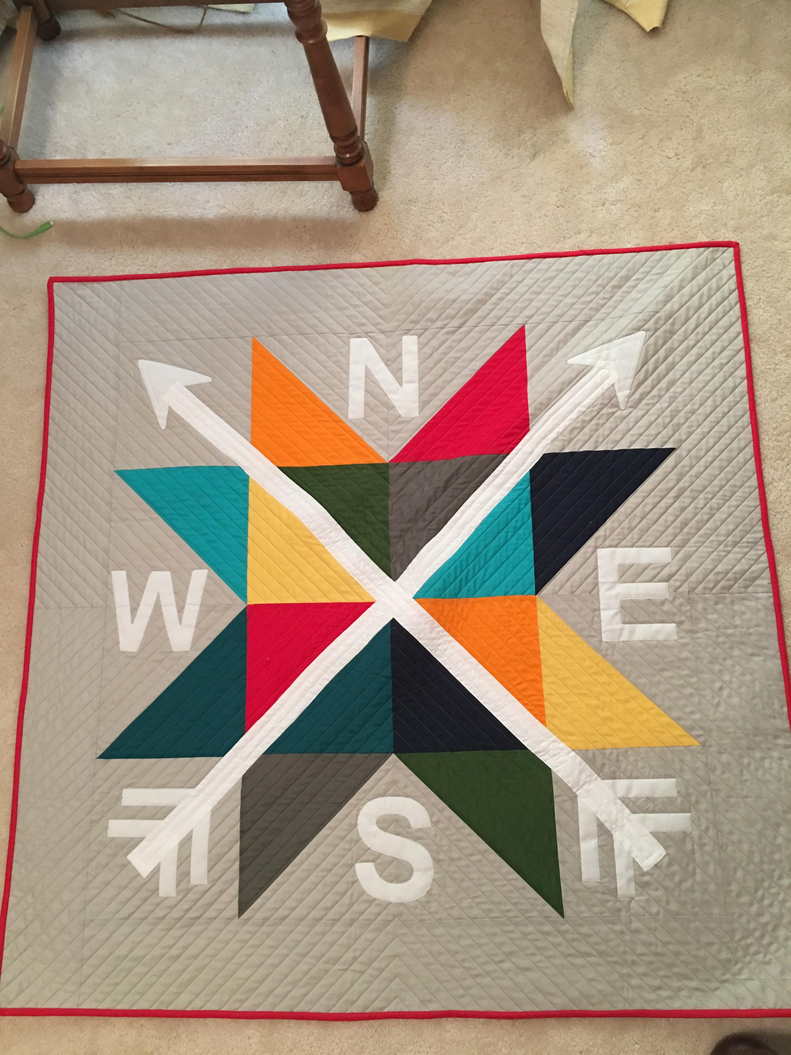 My wife made a quilt for my son. His baby room theme is maps and travel