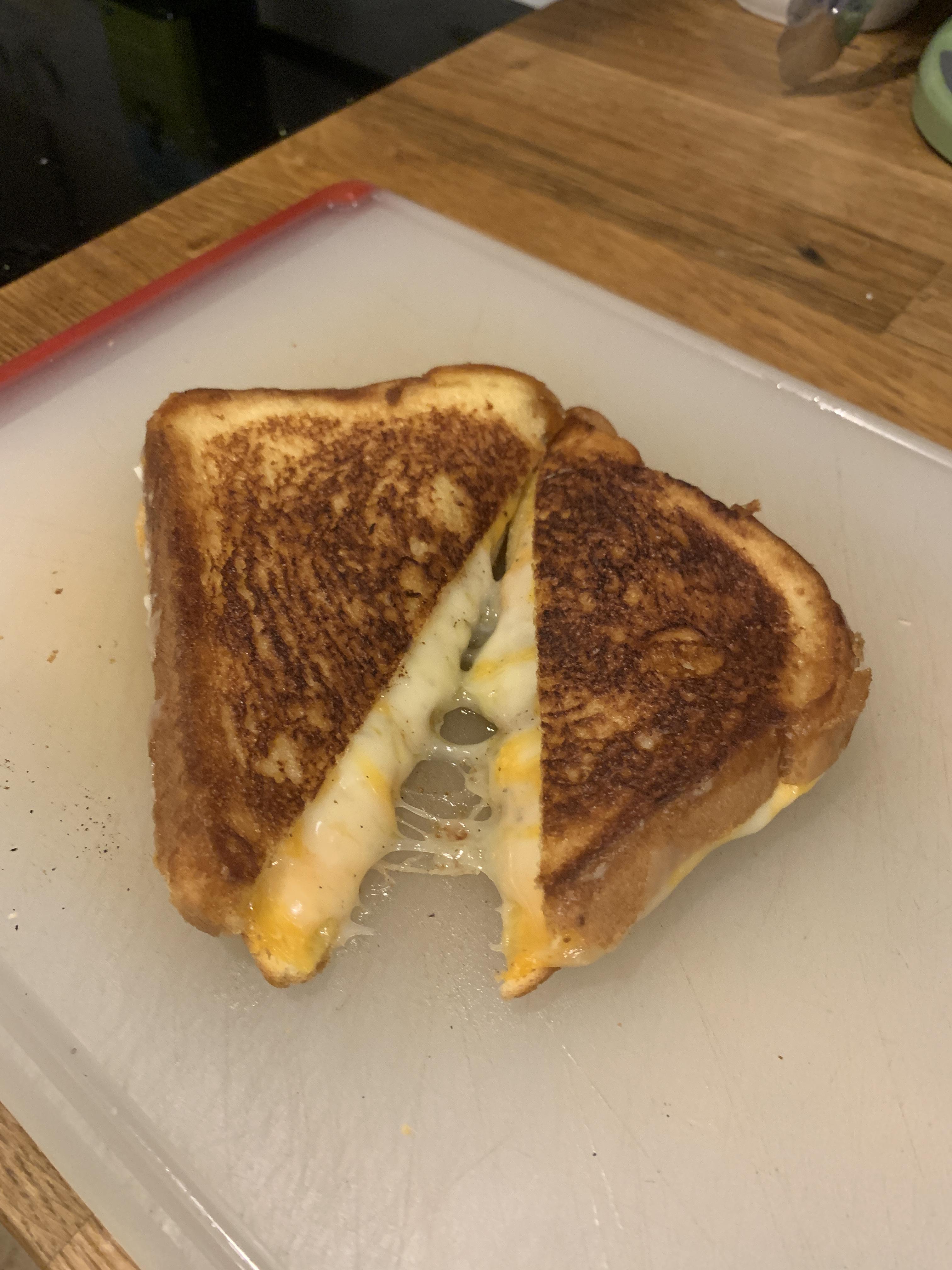 Muenster and American cheese with a little bit of cracked black pepper