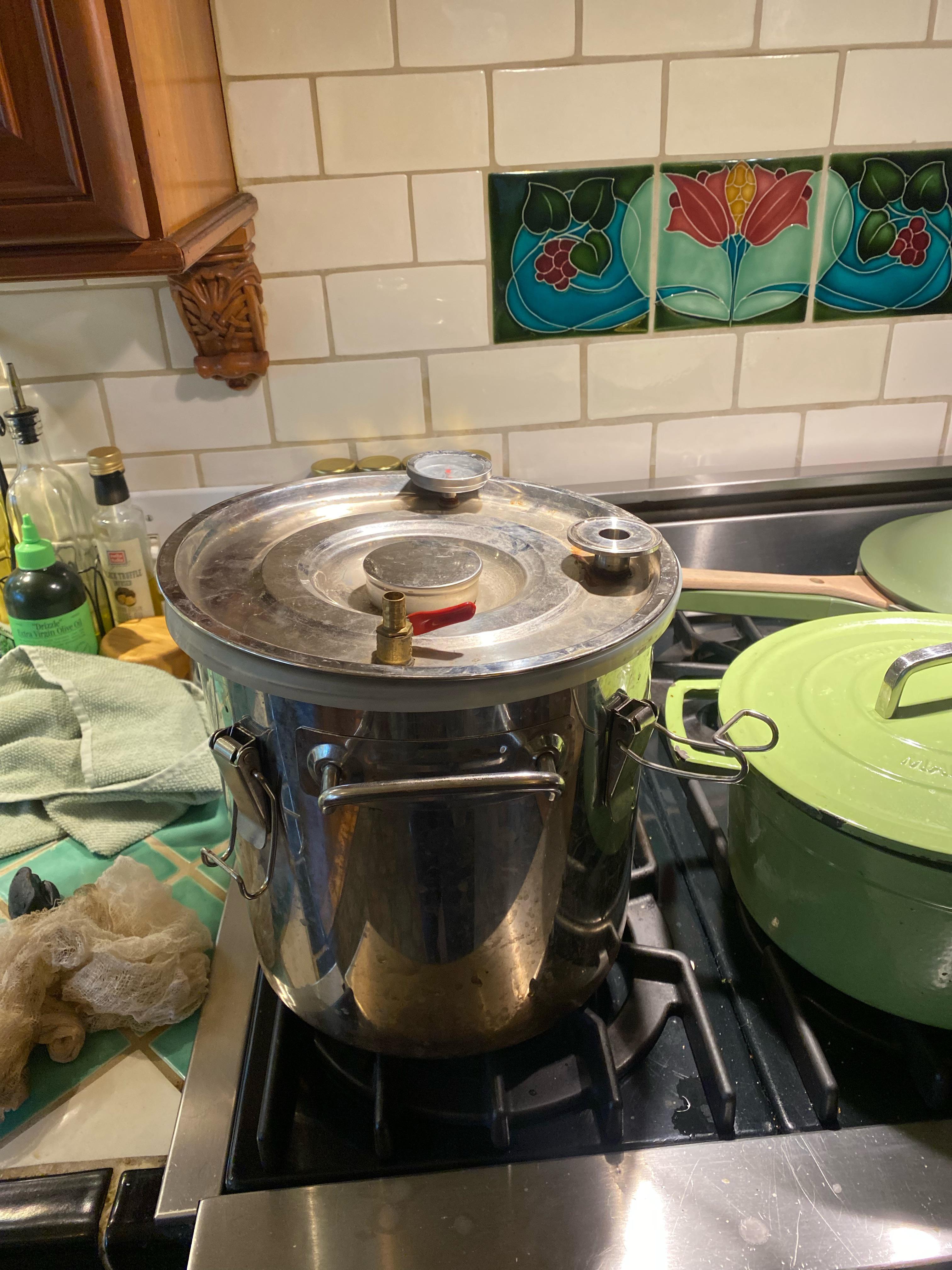 Using a pot distiller as pressure cooker it has a hole on the top for