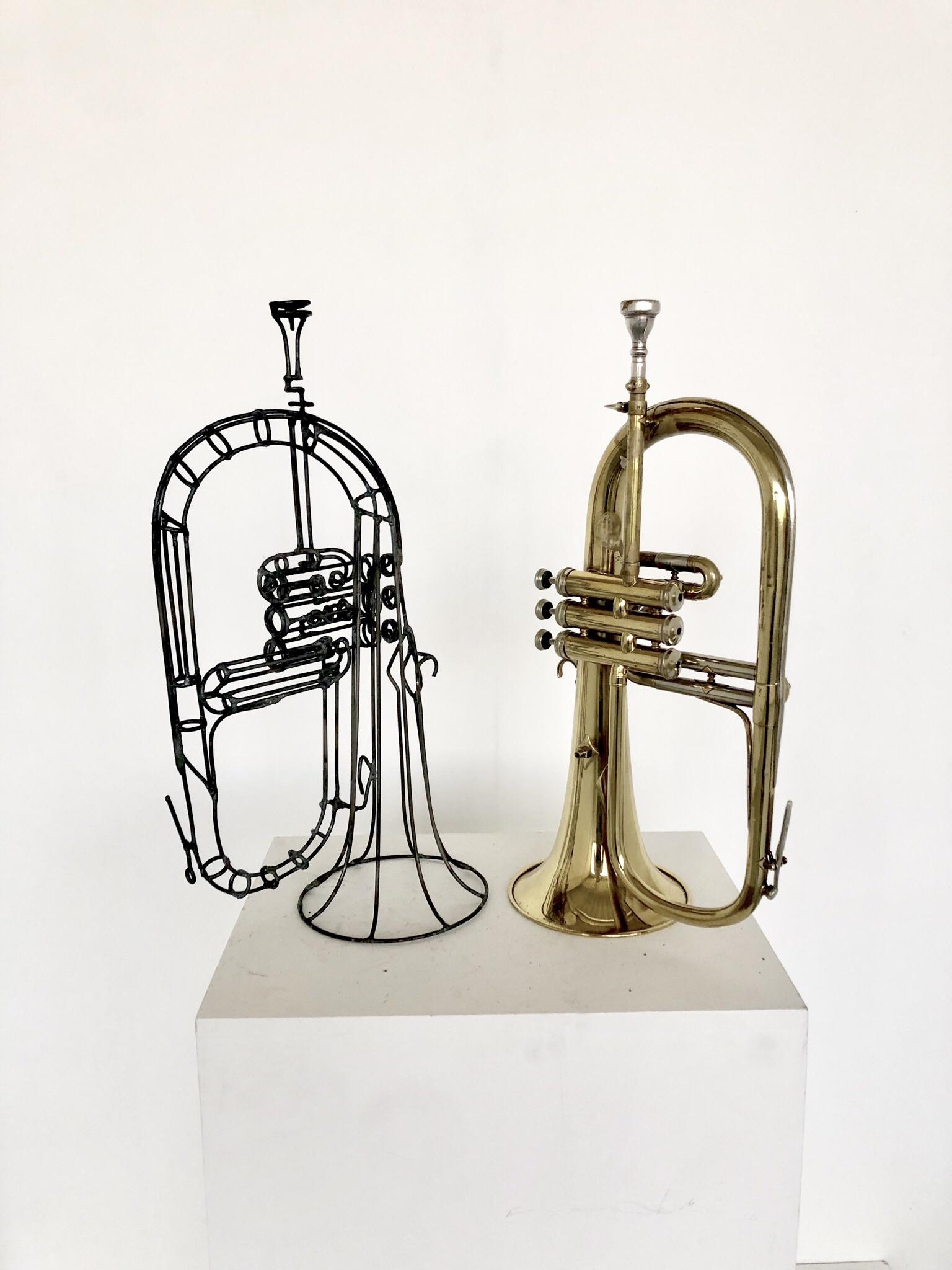 I made a flugelhorn out of welded steel rod for my sculpture class. r