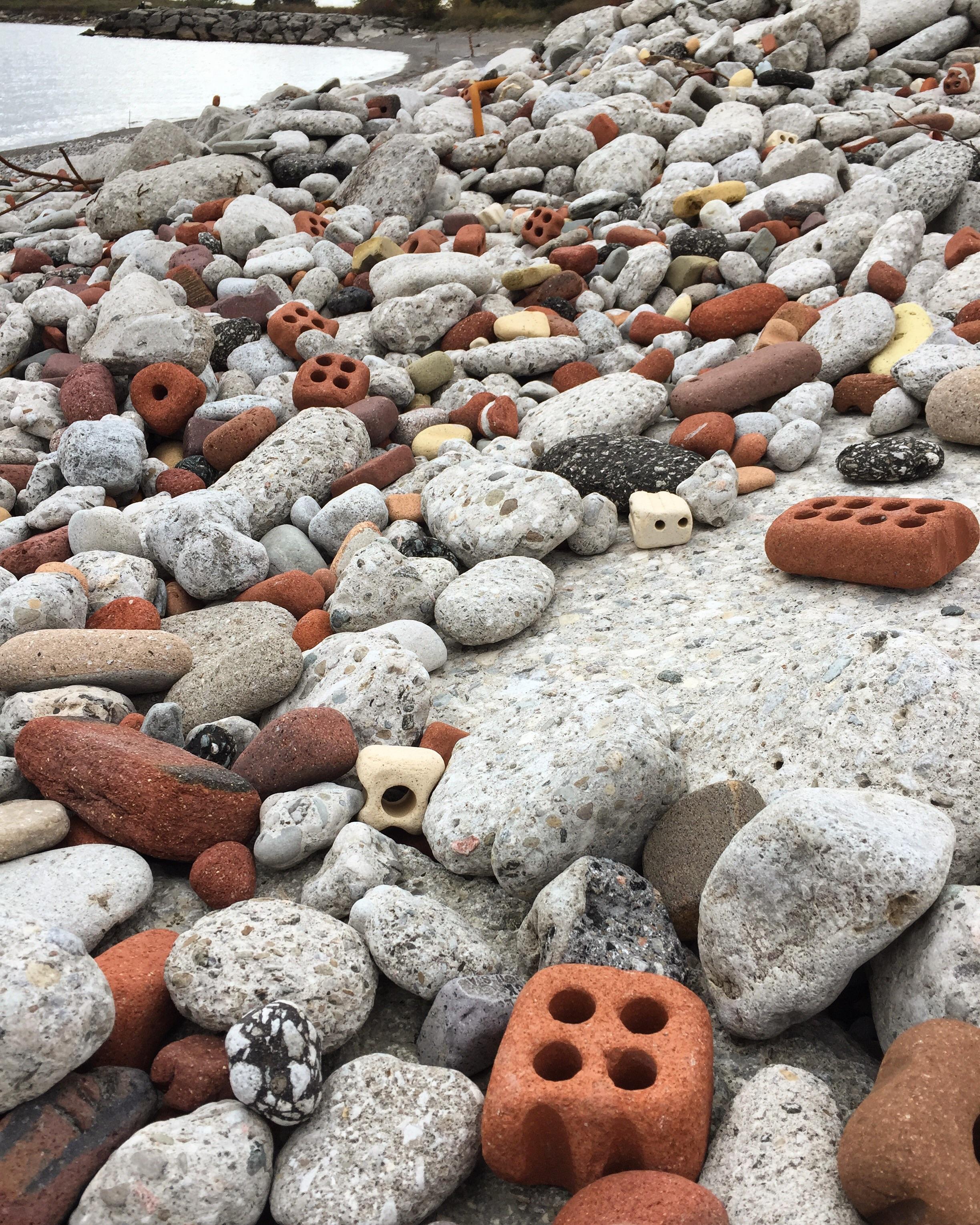 This beach made of waterworn bricks and construction conglomerate r