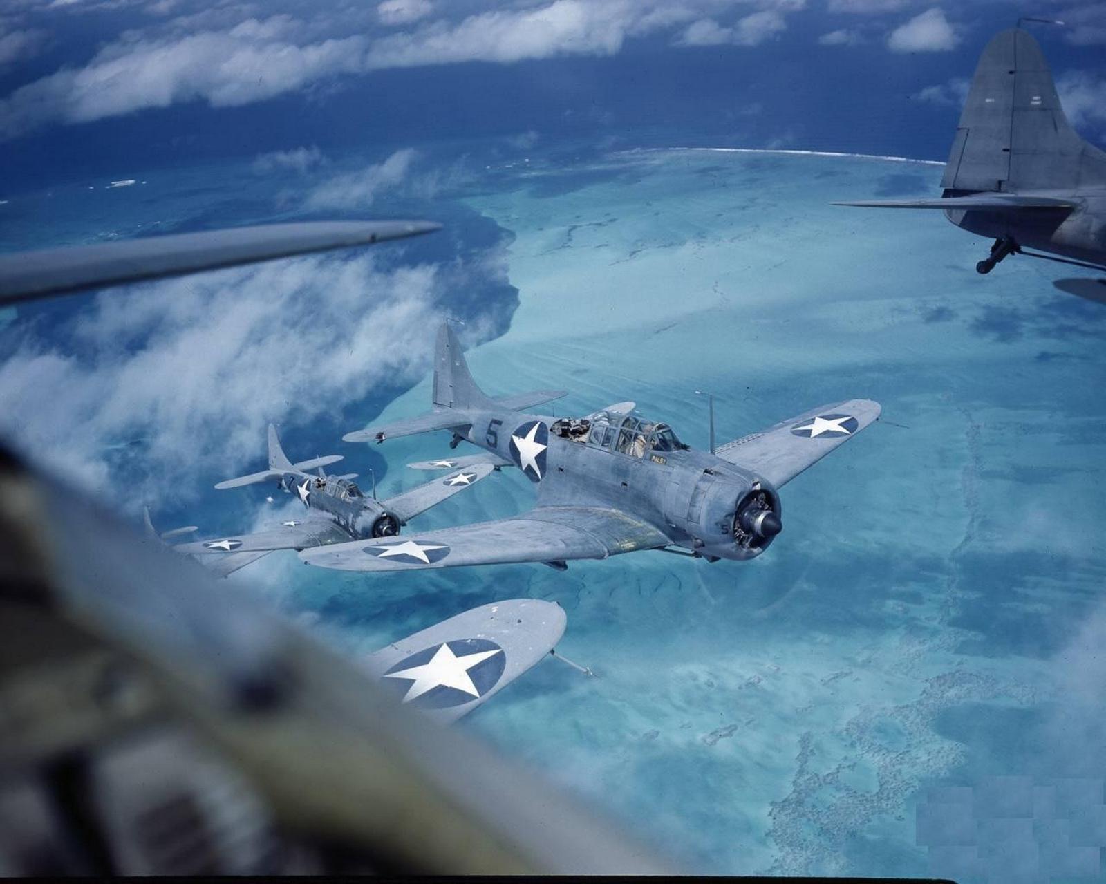 A flock of US Navy Douglas SBD Dauntless dive bombers over the Midway