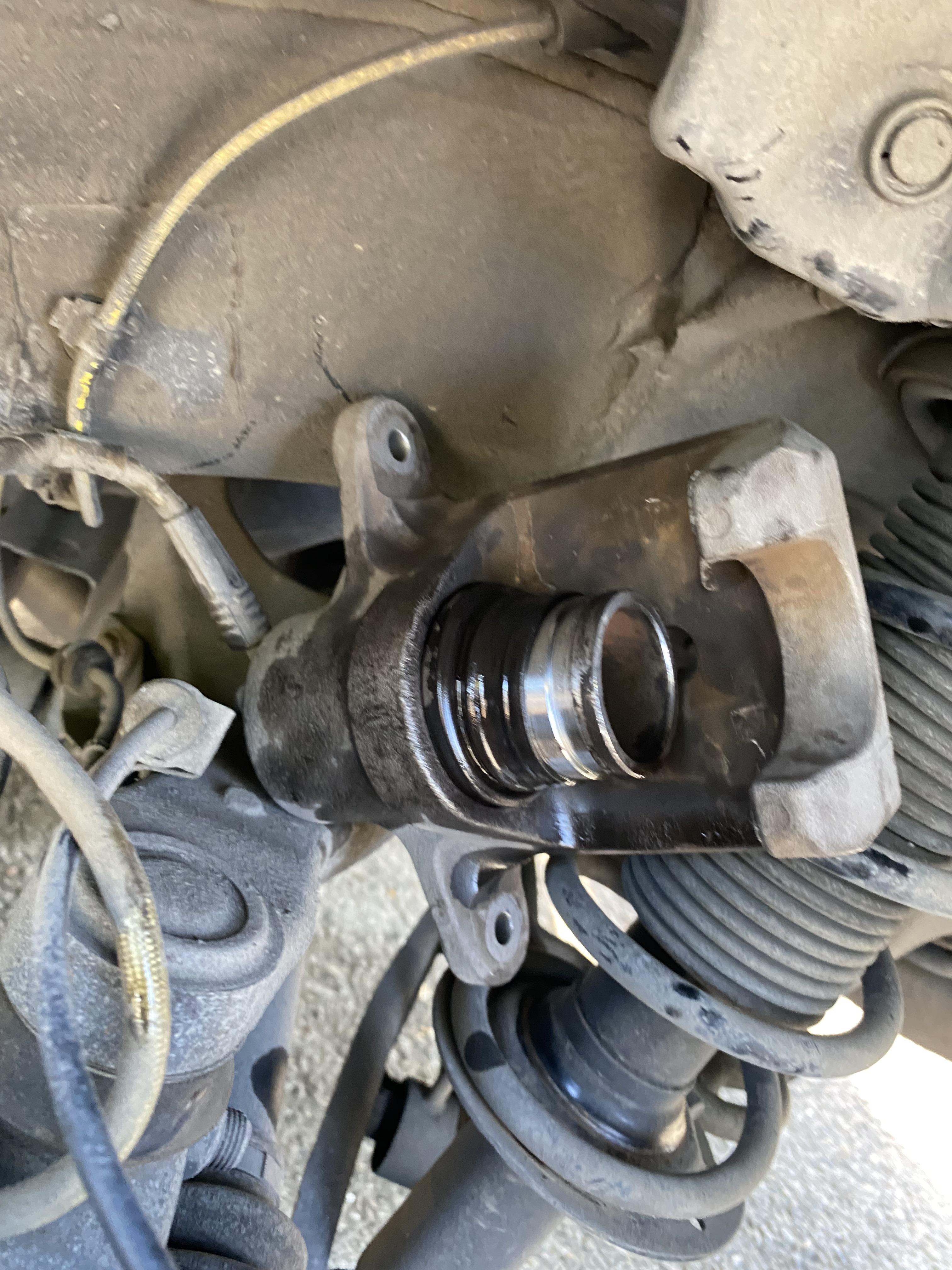 Any tips? Rear left caliper piston popped out…not sure how to pop it