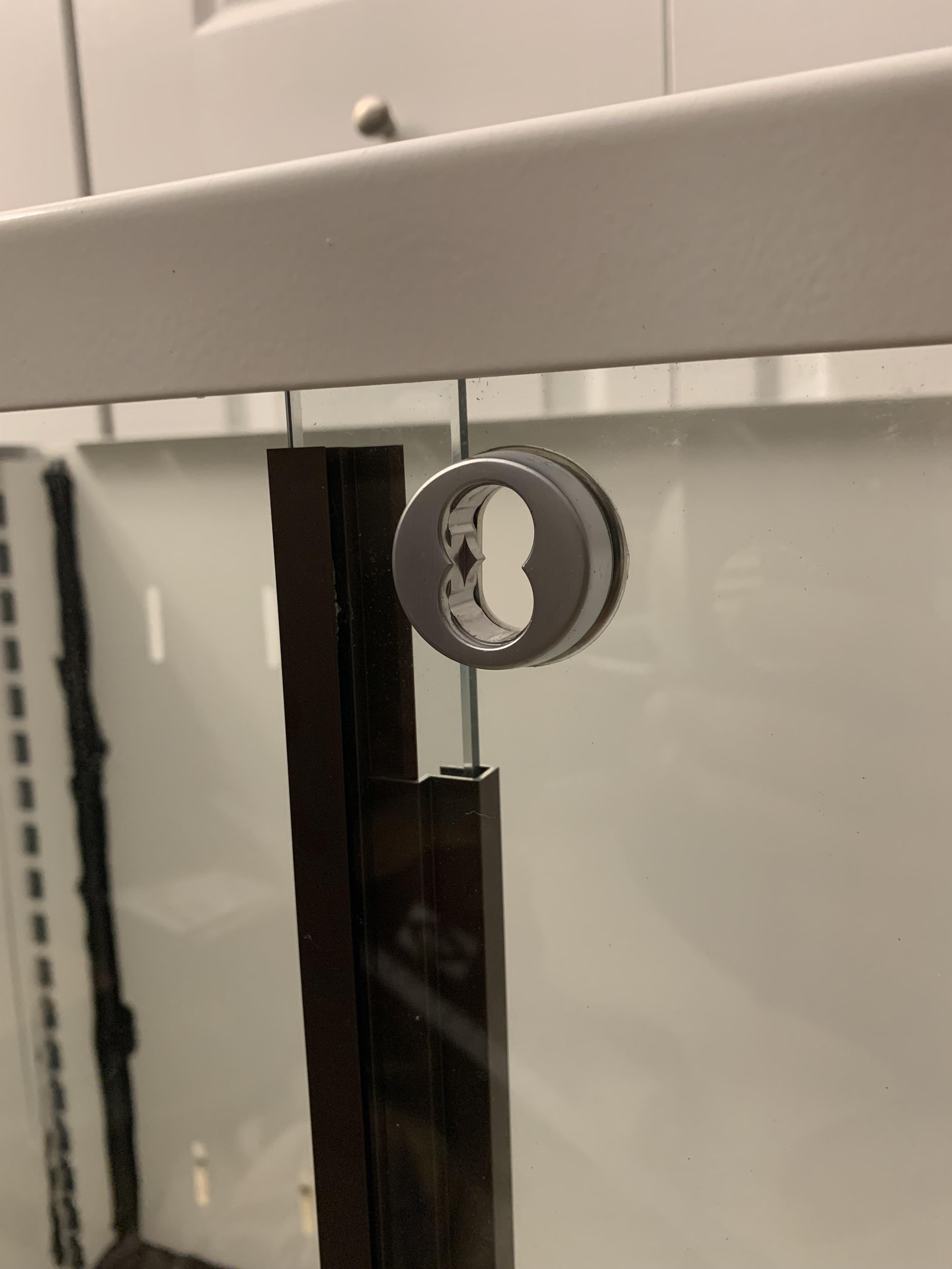 Where can I find a replacement lock for my sliding glass door display