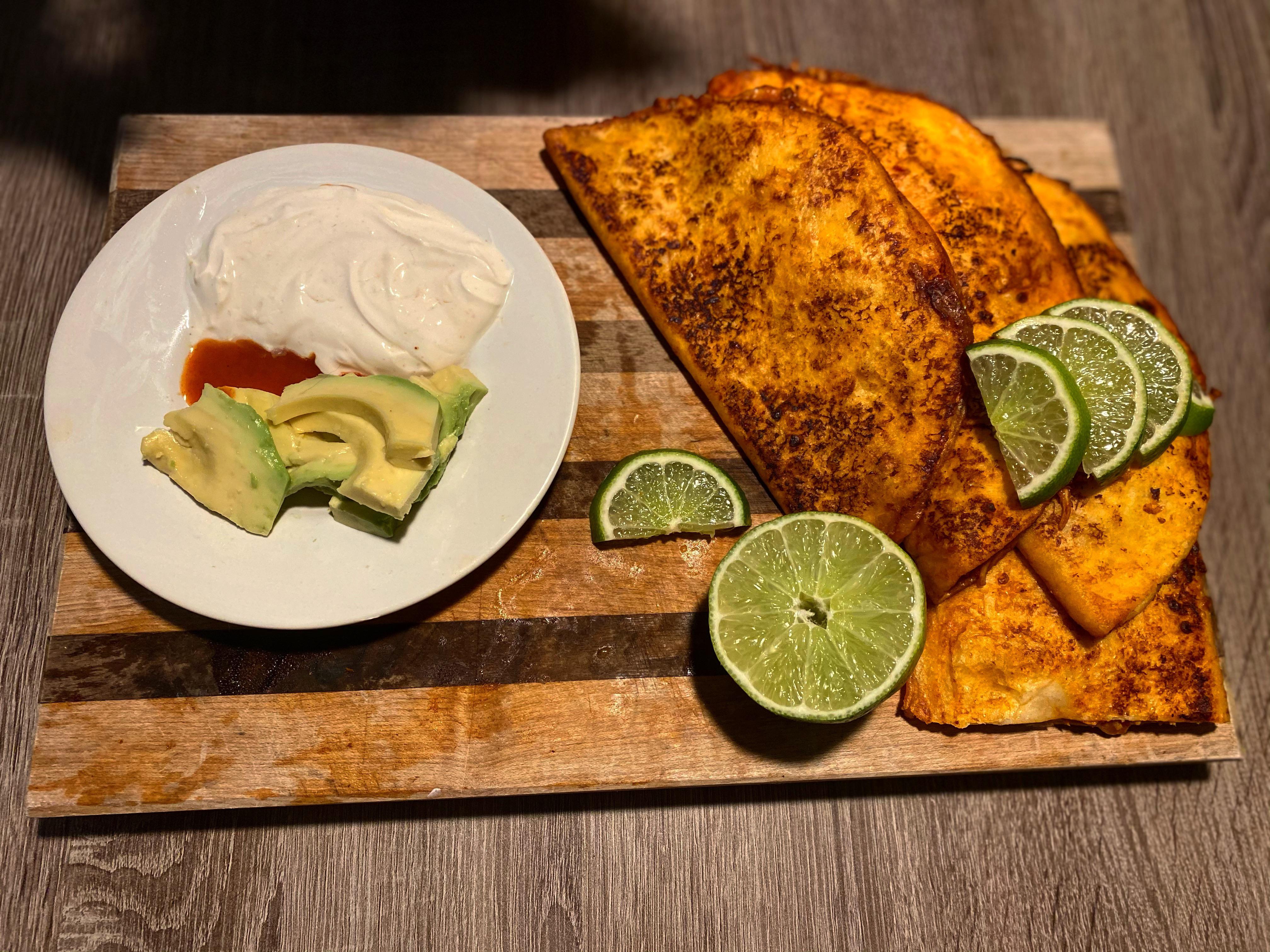 Chicken tinga quesadillas with lime crema and avocado. r/RateMyPlate