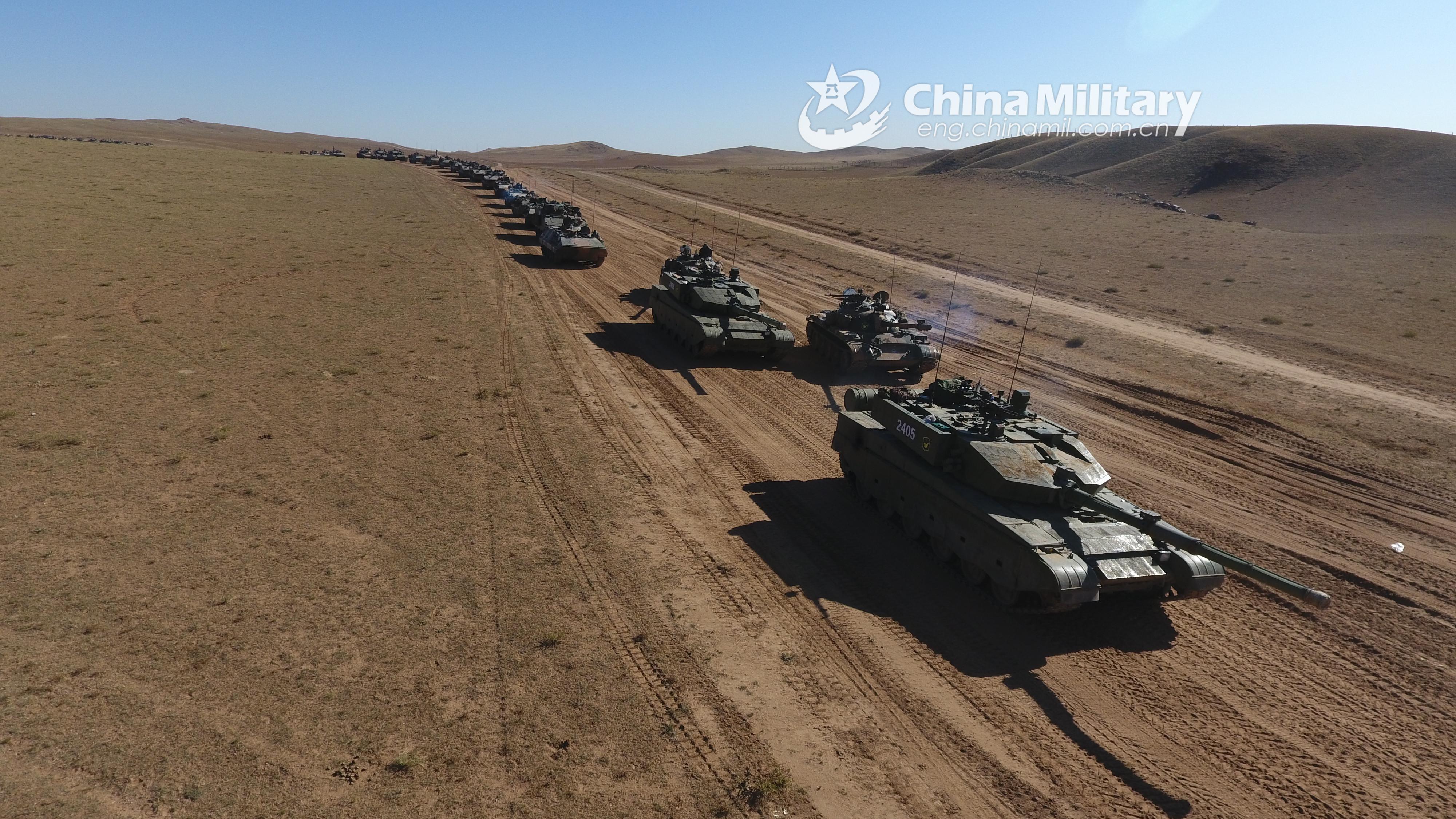 ZTZ99A, ZTZ59, ZBD04A, and ZSD89 in convoy maneuver. [4000x2250