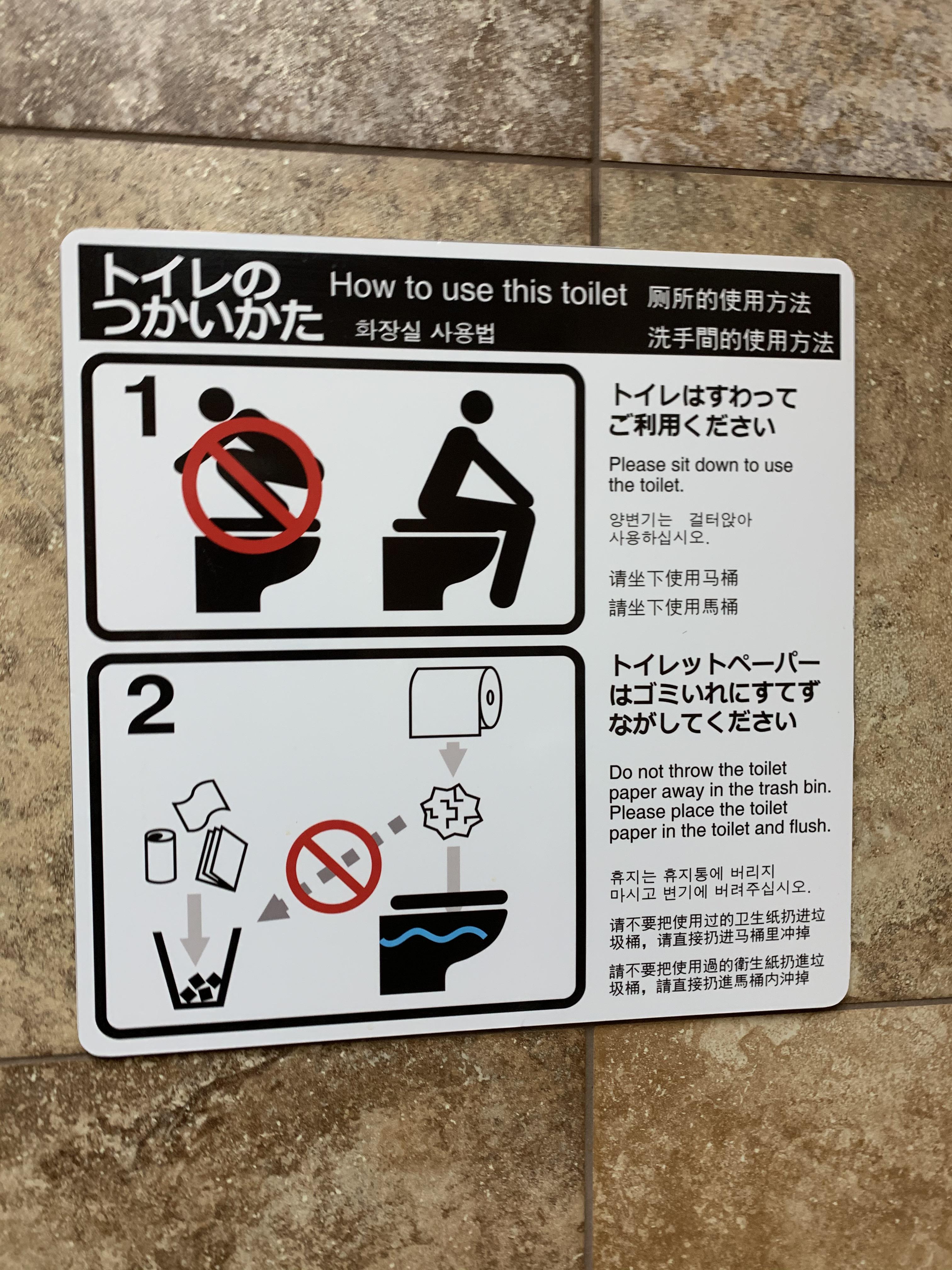 A sign in a gas station bathroom near Yellowstone National Park telling